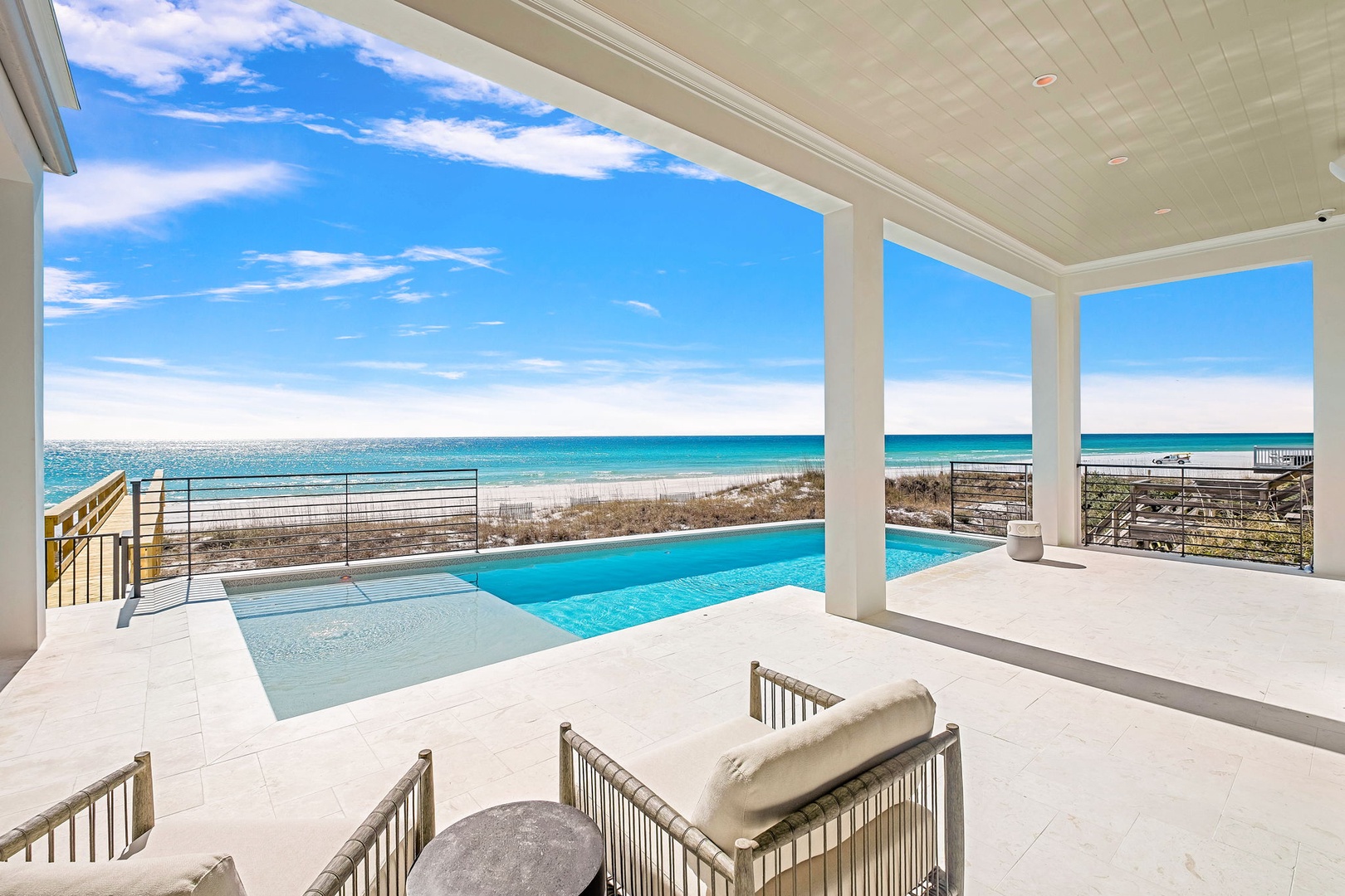 Unwind poolside with breathtaking ocean views stretching to the horizon from your covered terrace.