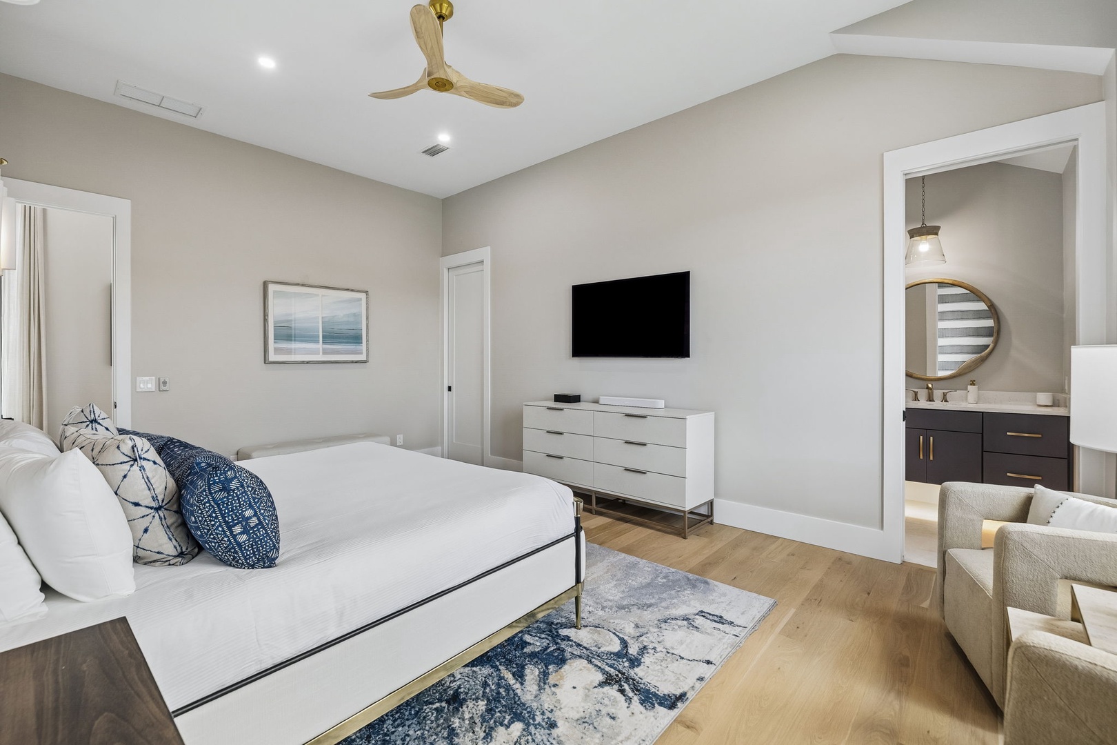 Relax in your serene primary suite with vaulted ceilings, plush bedding, and a private ensuite bath just steps away.