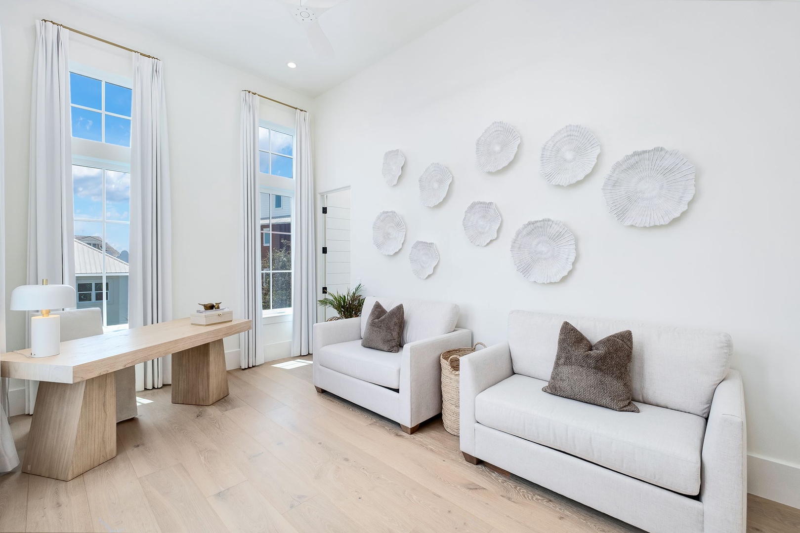 Unwind in your bright coastal living space, where soft seating and natural textures create the perfect retreat for relaxing after a day of exploration.