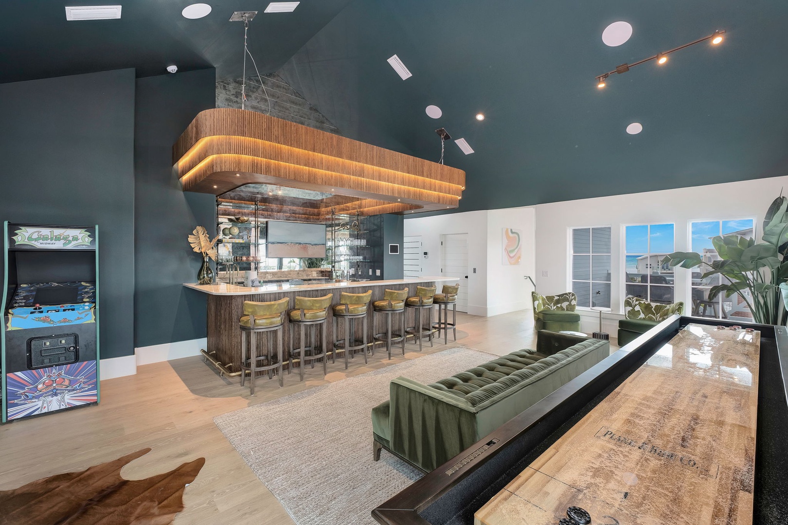 Step into a stylish communal space designed for relaxation and connection. The stunning wood-wrapped bar invites you to gather with friends, while plush seating and warm lighting create a welcoming atmosphere throughout your stay.
