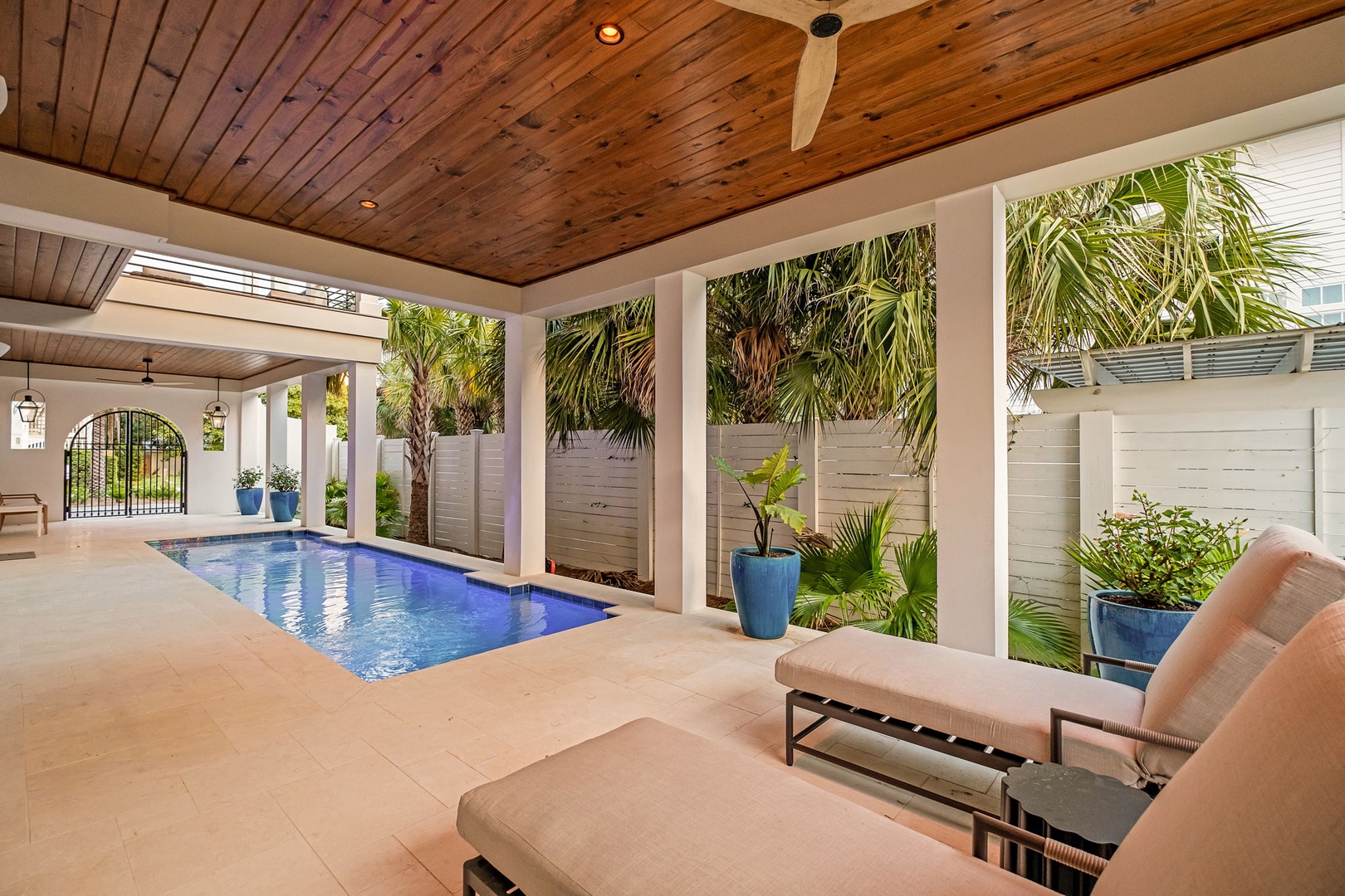 Your private pool sanctuary awaits, surrounded by tropical palms and comfortable loungers for ultimate relaxation.