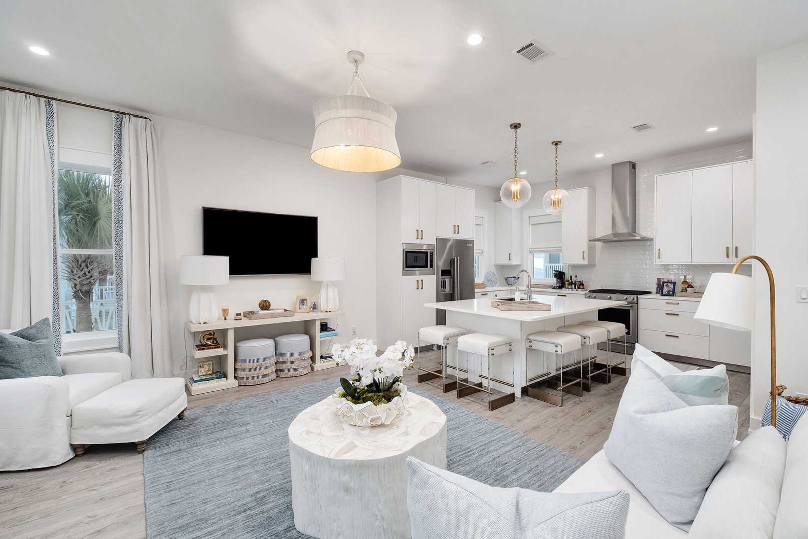 Relax in your bright, open living space where coastal elegance meets modern comfort. The sleek kitchen and stylish lounge invite you to unwind in style.