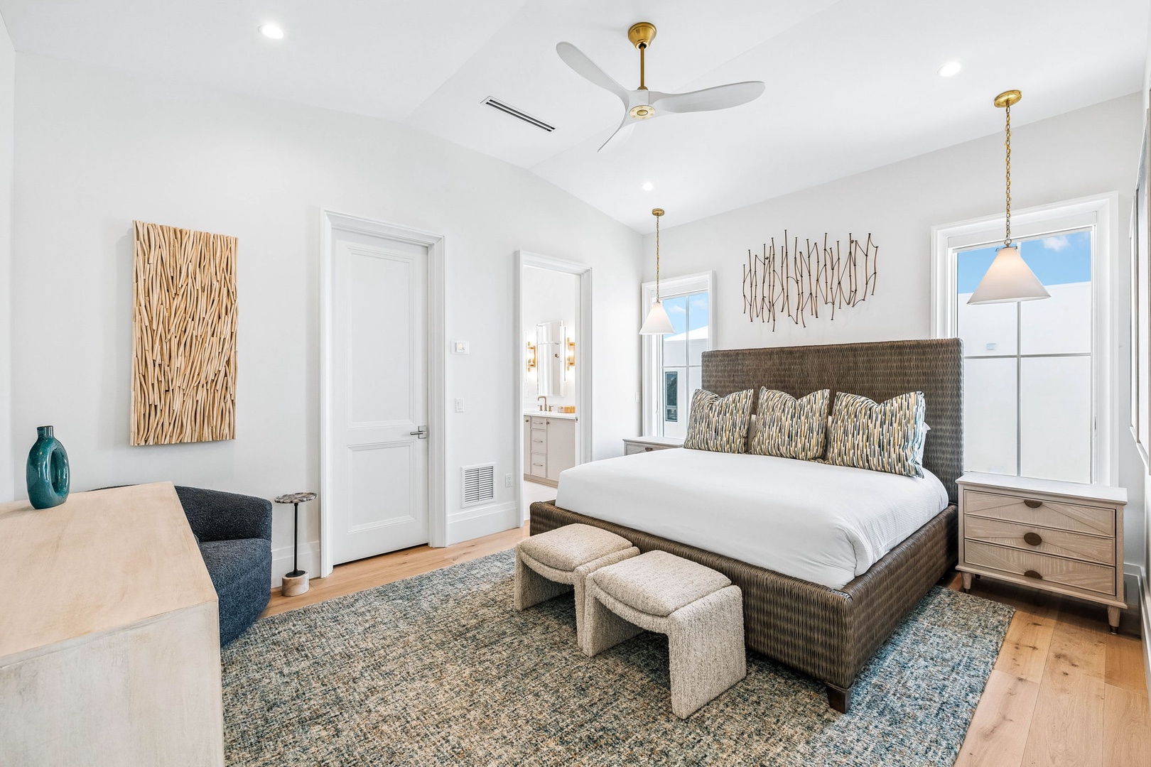 Settle into your serene coastal retreat, where ocean breezes and natural light fill your beautifully appointed bedroom. The plush bed and calming palette promise restful nights after your beach adventures.