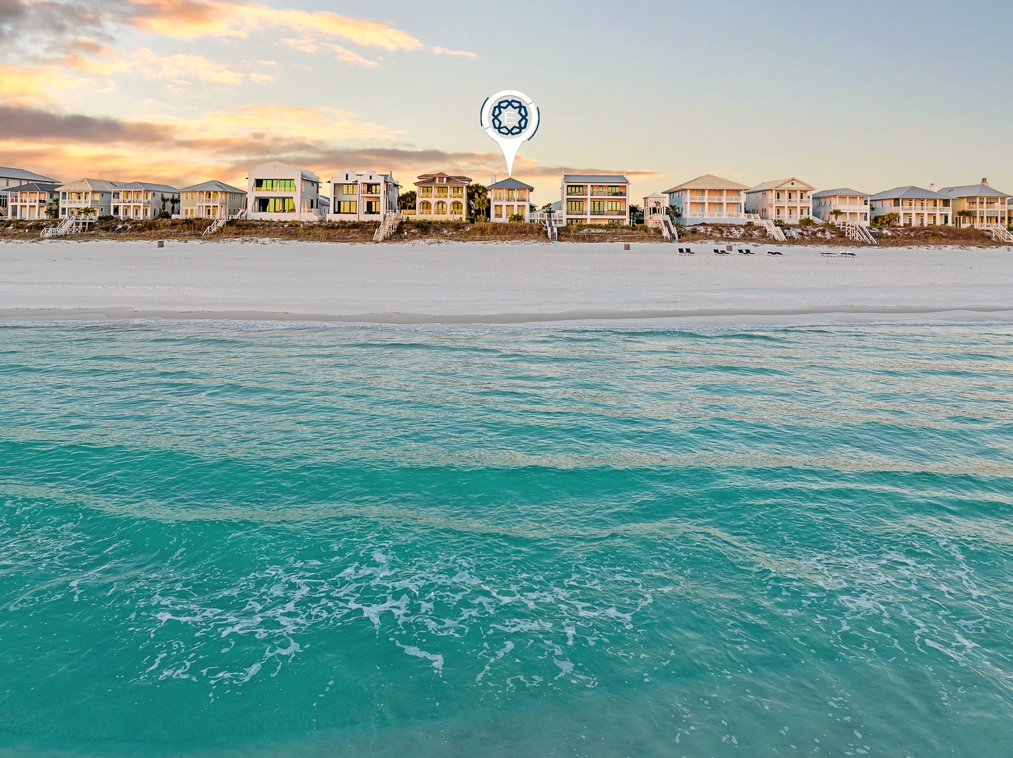 Stunning beachfront location with crystal-clear turquoise waters and pristine white sand stretching endlessly along the shore.