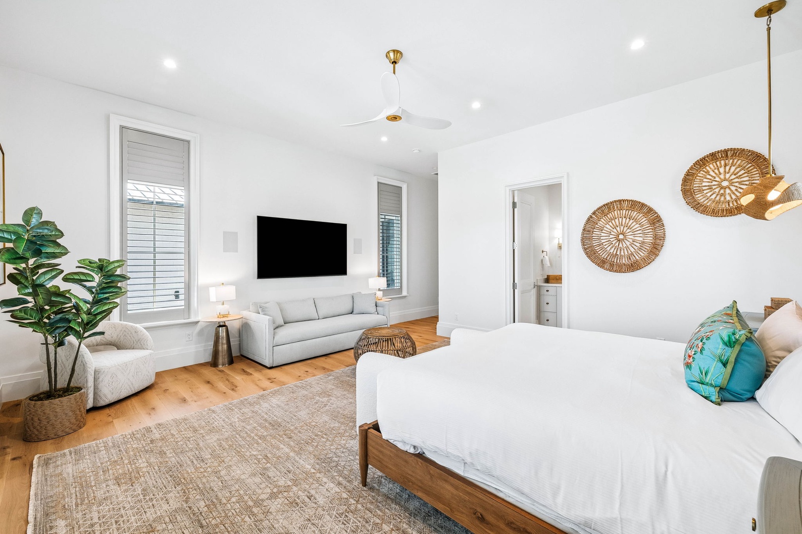 Your bright, airy retreat blends coastal charm with modern comfort. Sink into plush seating, unwind in the spacious king bed, and enjoy the natural warmth of wood floors and woven accents that make this space feel like home.