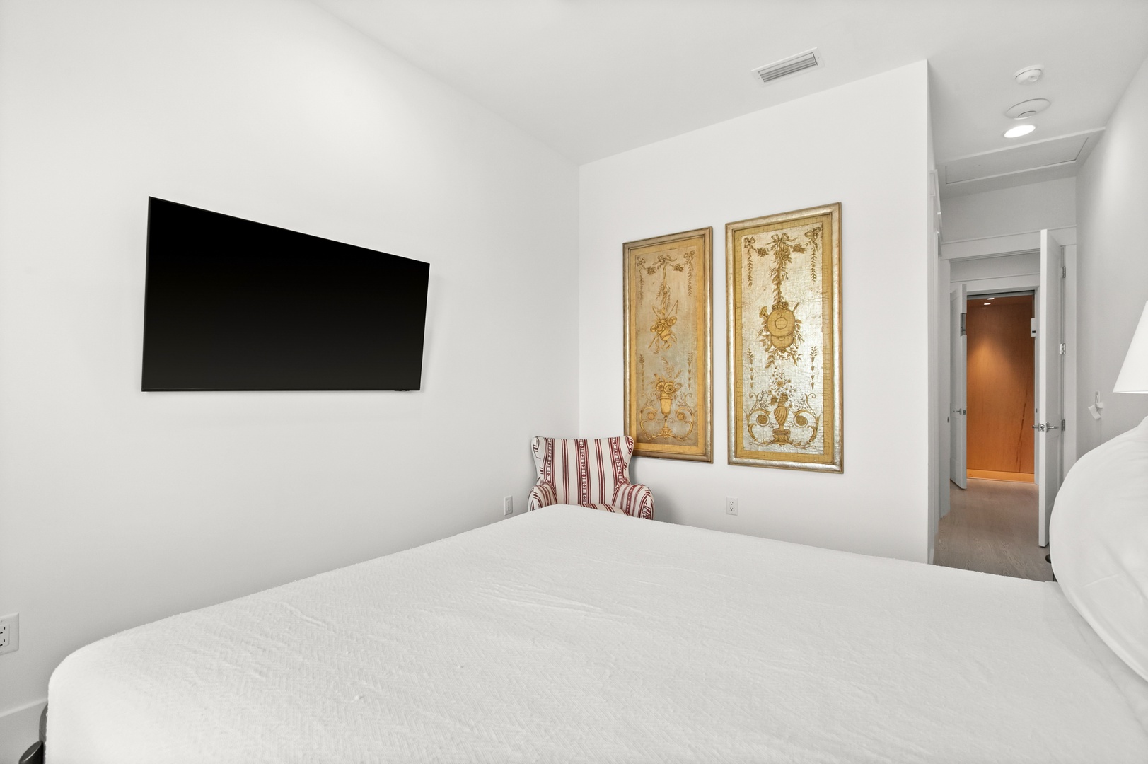 Sink into the plush comfort of your own serene sleeping space, where elegant artwork and modern amenities come together to ensure restful nights throughout your stay.