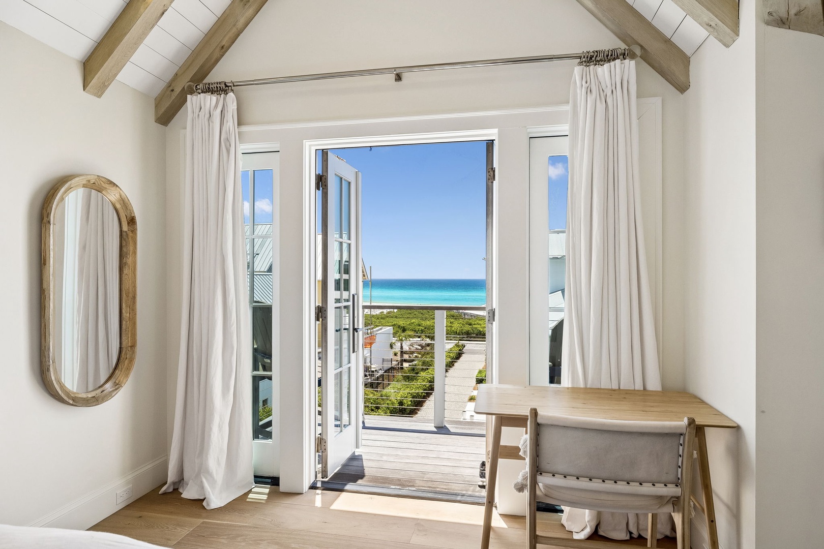 This coastal retreat offers stunning turquoise water views from your private balcony, where sea breezes and sunshine create the perfect backdrop for your beach getaway.