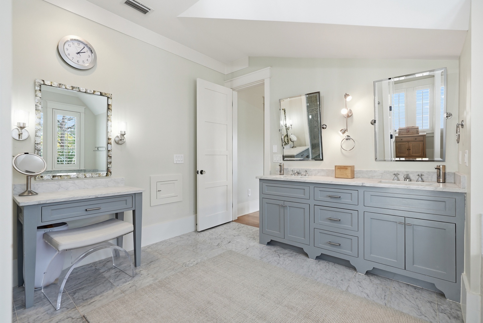 Step into your private spa-like retreat with elegant dual vanities, soft lighting, and a makeup station—perfect for your morning routine or unwinding after a day of adventure.