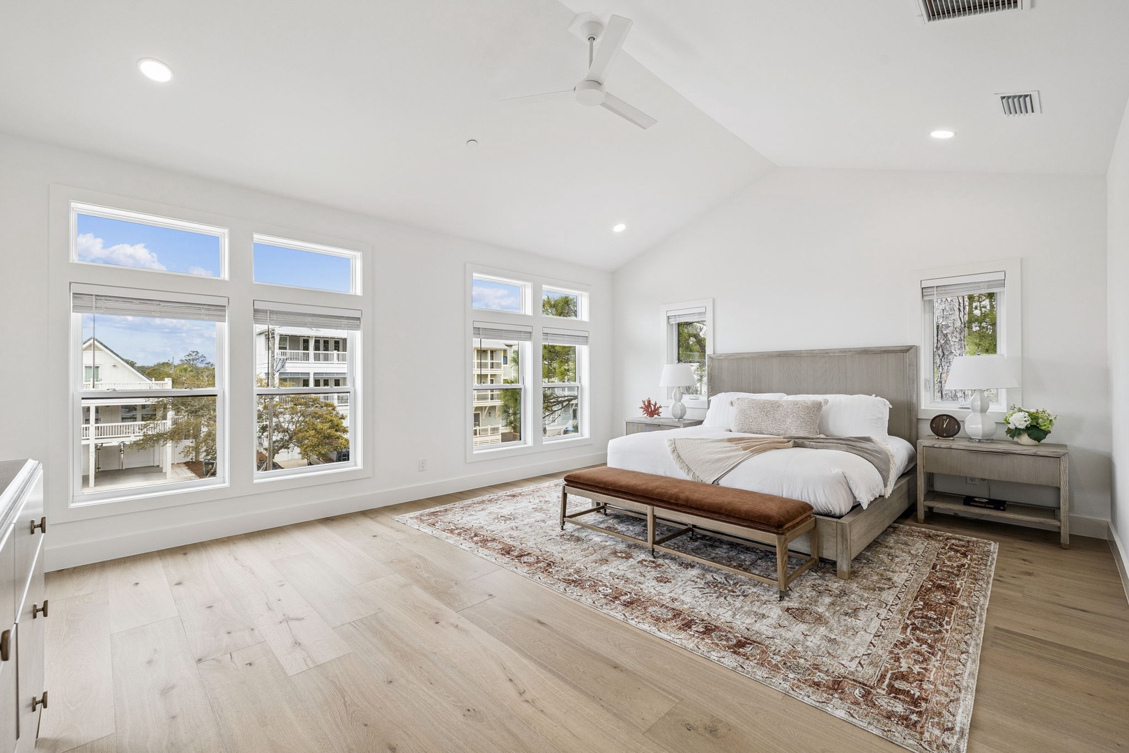 Wake up in your spacious master bedroom with soaring vaulted ceilings, abundant natural light, and peaceful neighborhood views.