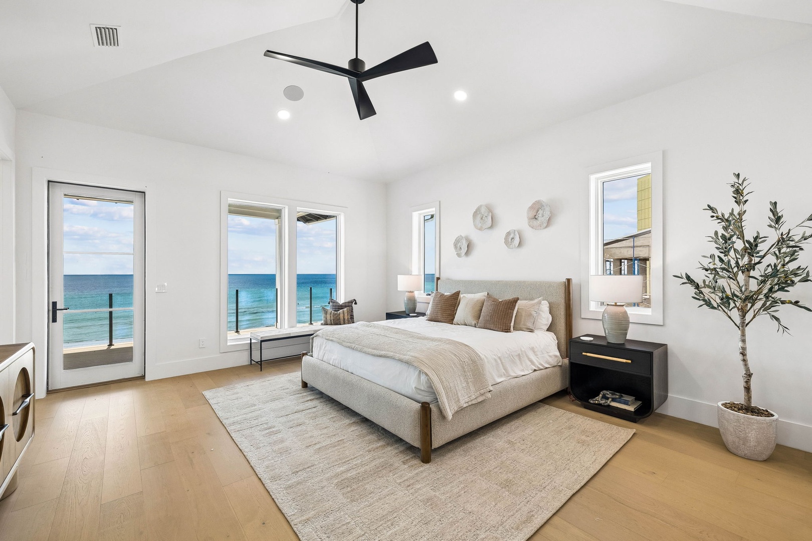 Wake up to breathtaking ocean views right from your bed. This serene bedroom opens to a private balcony where you can start each morning with the sound of waves and endless blue horizons.