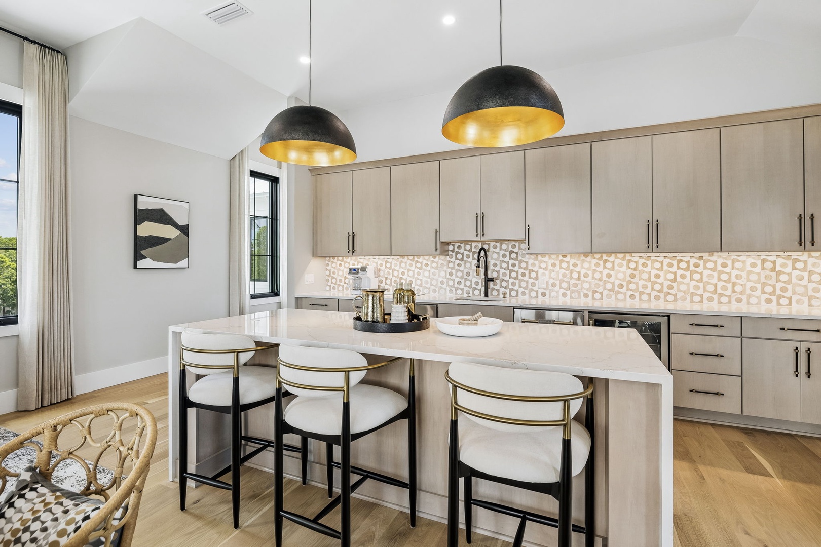 Your culinary haven awaits, where sleek marble surfaces and designer lighting create the perfect setting for morning coffee or evening appetizers.