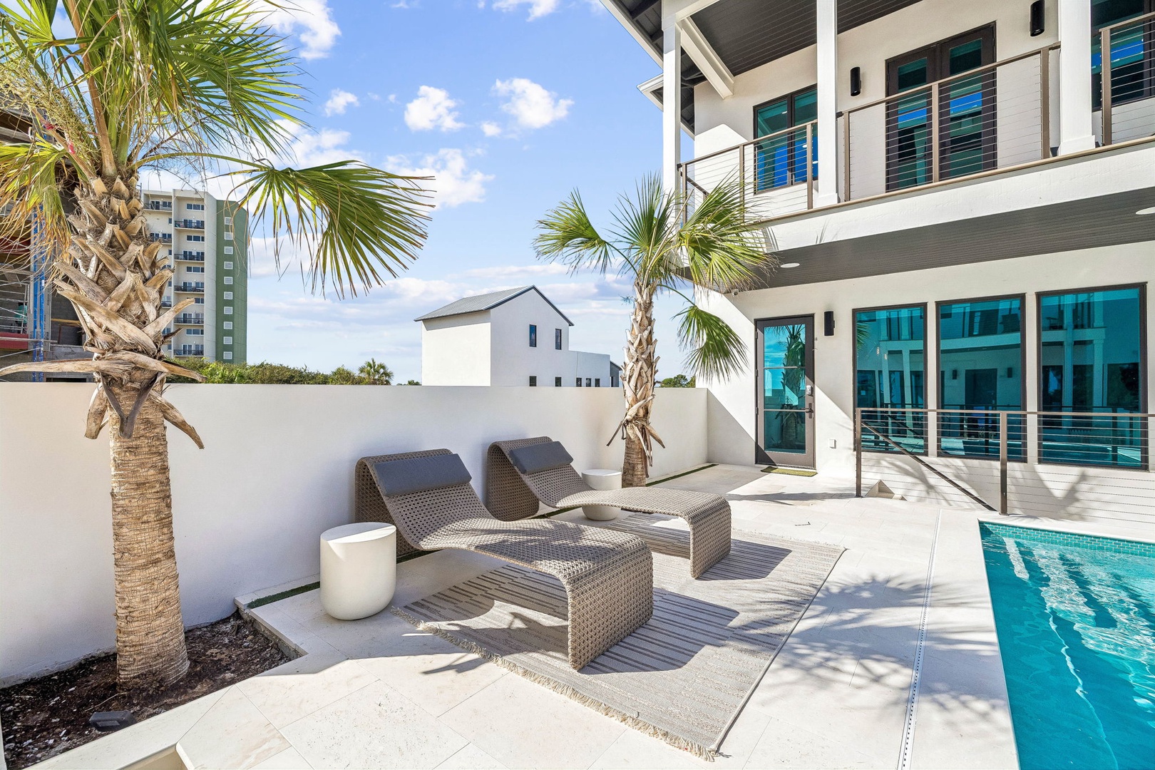 Your private poolside retreat awaits, complete with chaise lounges under swaying palms and Florida's sunshine warming your skin. This is your space to unwind, sip morning coffee, or dive in for a refreshing swim whenever the mood strikes.