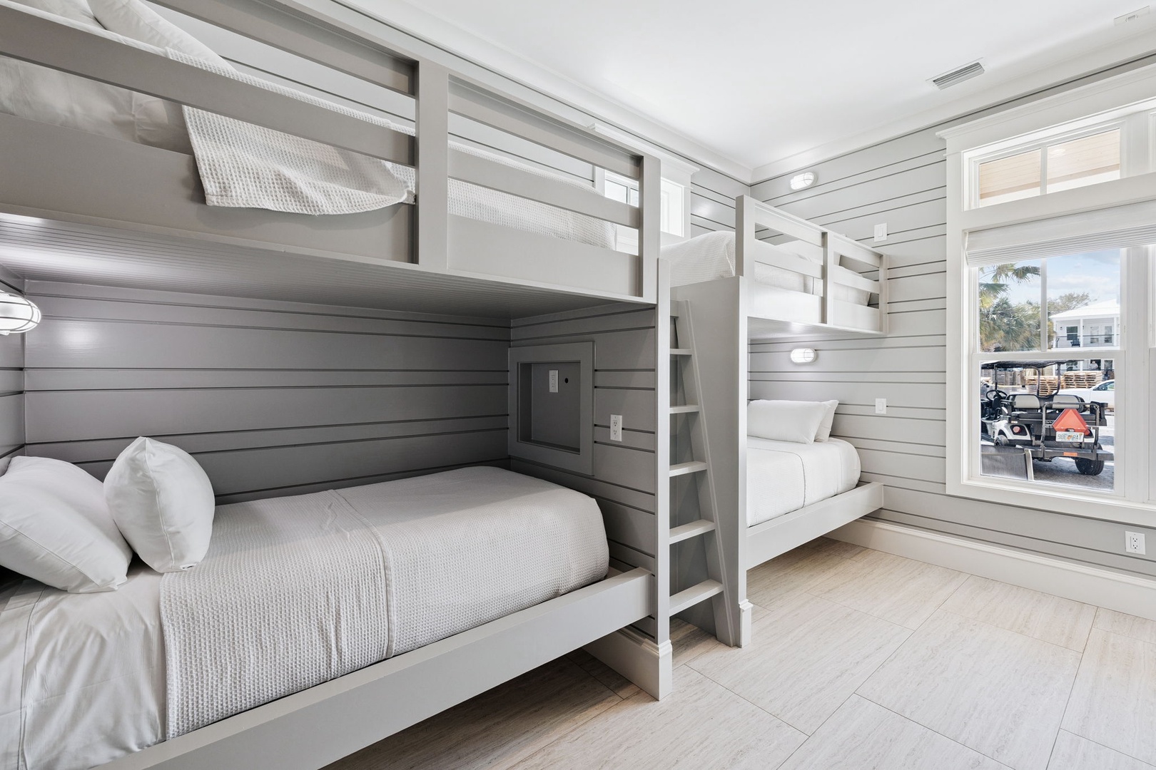 Sleep soundly in your stylish bunk room with built-in reading lights and crisp linens for the perfect rest.