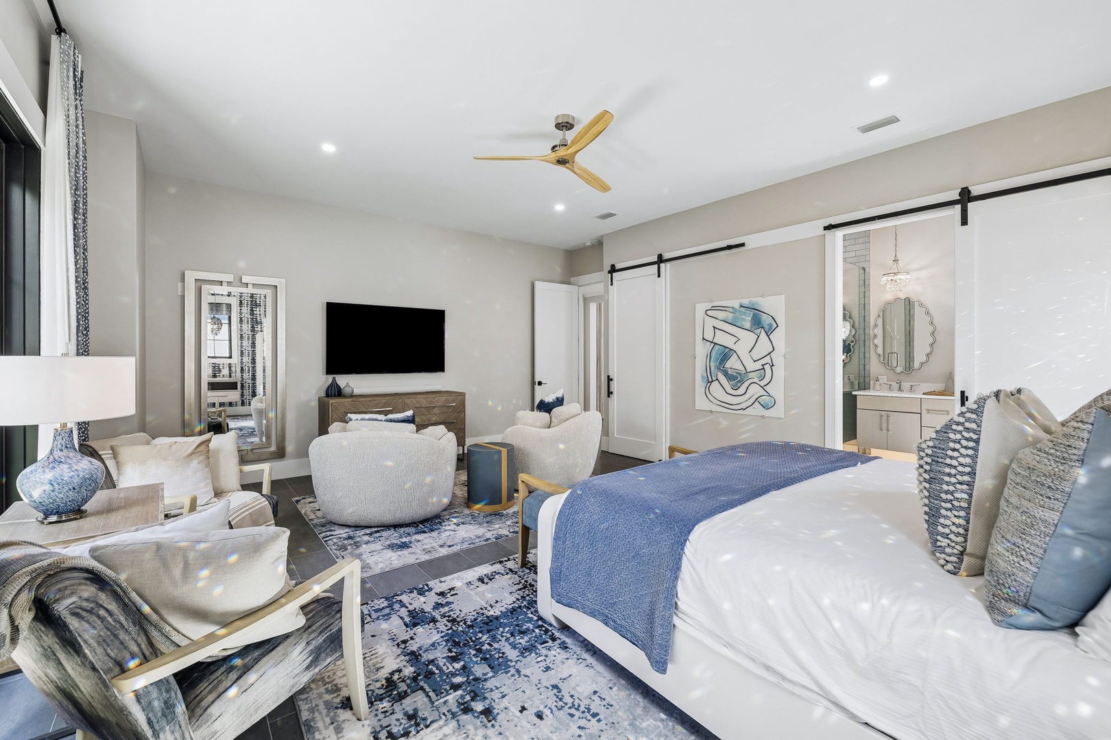 Unwind in your serene retreat with plush furnishings and a cozy lounge area. The soothing blue accents and soft textures create a peaceful escape where you can relax after exploring.
