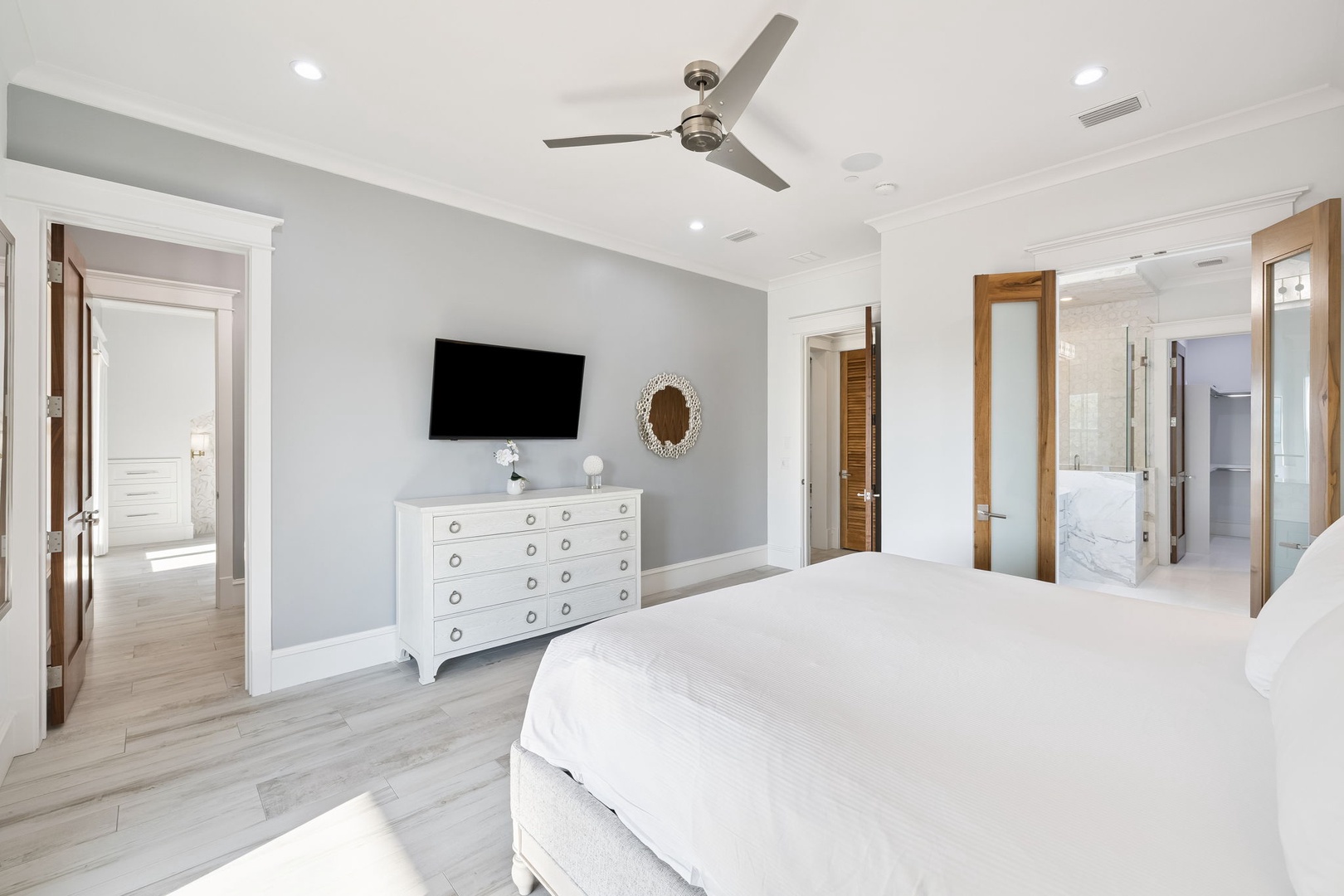 Rest peacefully in your elegant master suite, featuring crisp linens, modern amenities, and an ensuite bathroom for ultimate comfort.