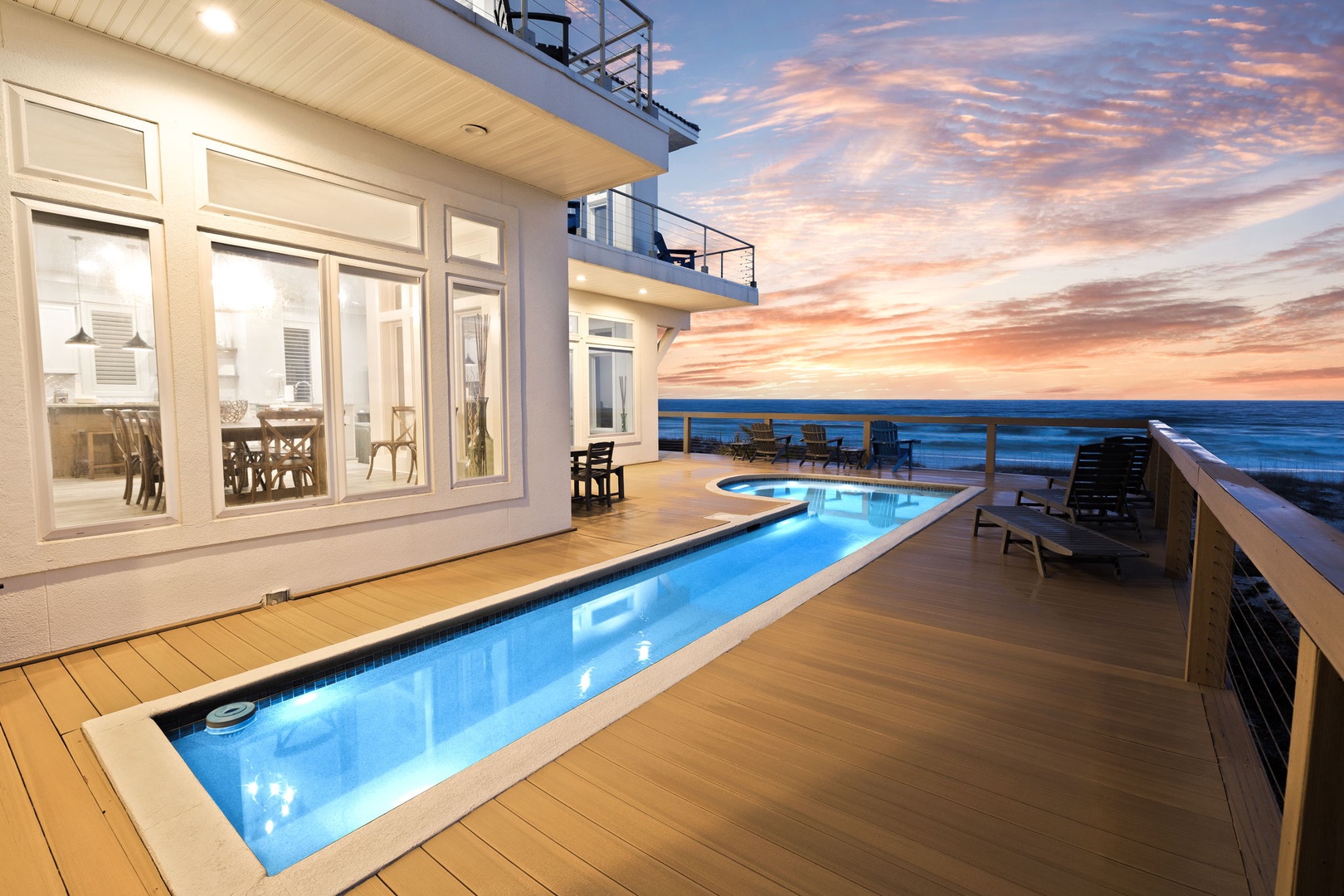 Modern beachfront property with private pool and oceanfront terrace, perfect for watching spectacular sunsets over the water.