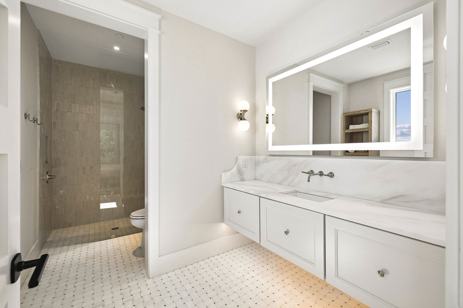 Refresh and rejuvenate in your elegant private bathroom with marble countertops, modern fixtures, and a spacious tiled walk-in shower designed for ultimate comfort.