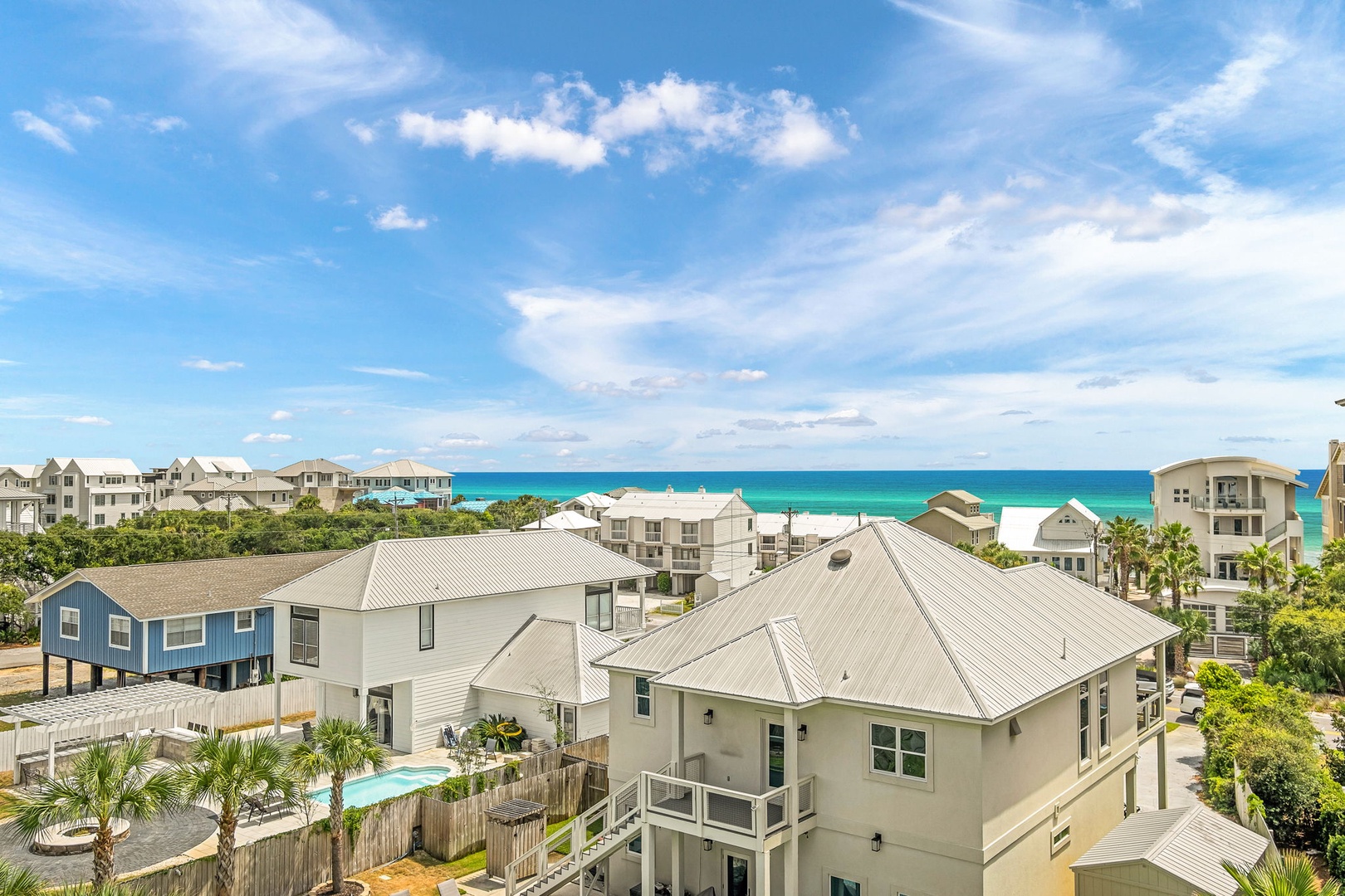 This vacation rental enjoys a prime coastal location with stunning views of the turquoise Gulf waters and pristine white sand beach just steps away.