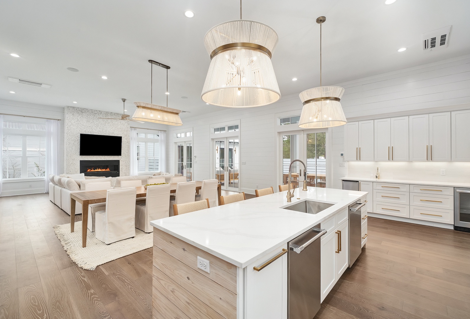 Step into this stunning open-concept space where your gourmet kitchen flows seamlessly into the cozy living area with fireplace.