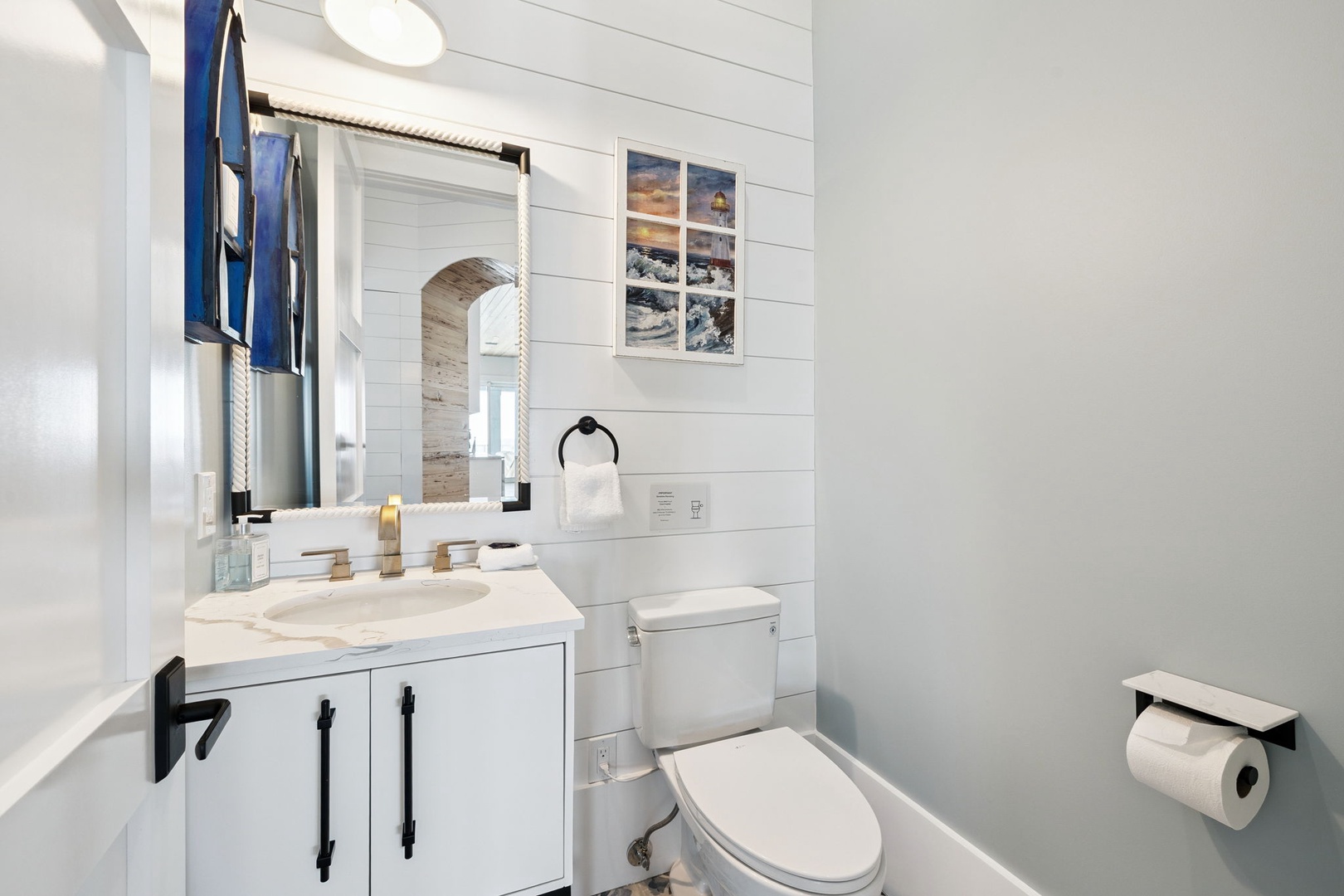 Your private bathroom features marble countertops, modern fixtures, and thoughtful nautical touches that create a spa-like retreat.