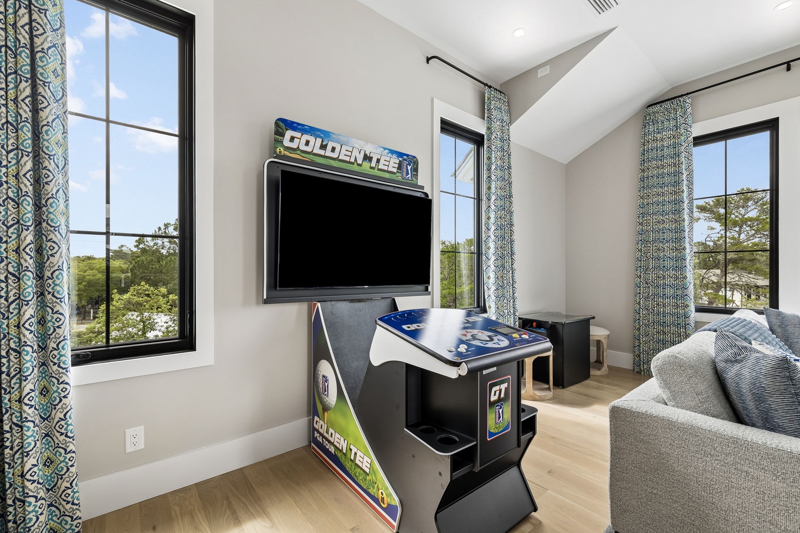 Challenge your group to a friendly competition on the arcade game, or unwind on the cozy couch while soaking in the tree-lined views through expansive windows.