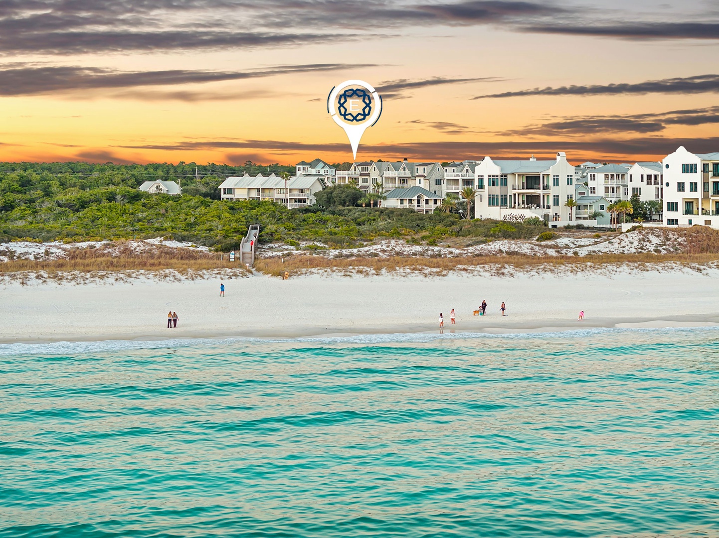 Beachfront property location with pristine white sand and turquoise waters at sunset.