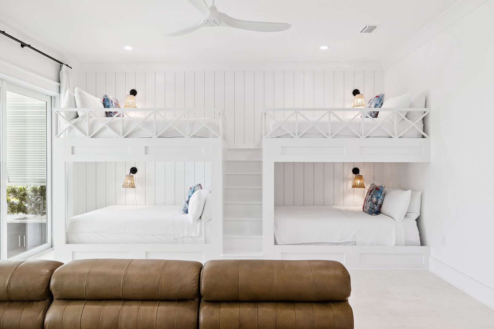 Your coastal bunk room sleeps four with privacy curtains, personal reading lights, and crisp white linens.