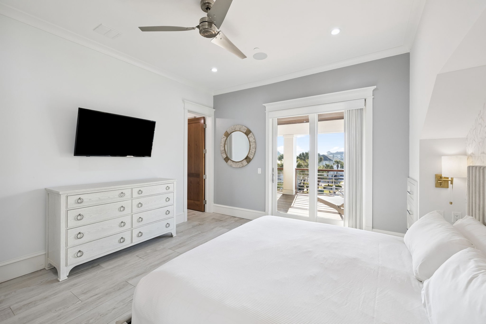 Rest peacefully in your bright bedroom with direct balcony access, ceiling fan, and entertainment center for ultimate comfort.