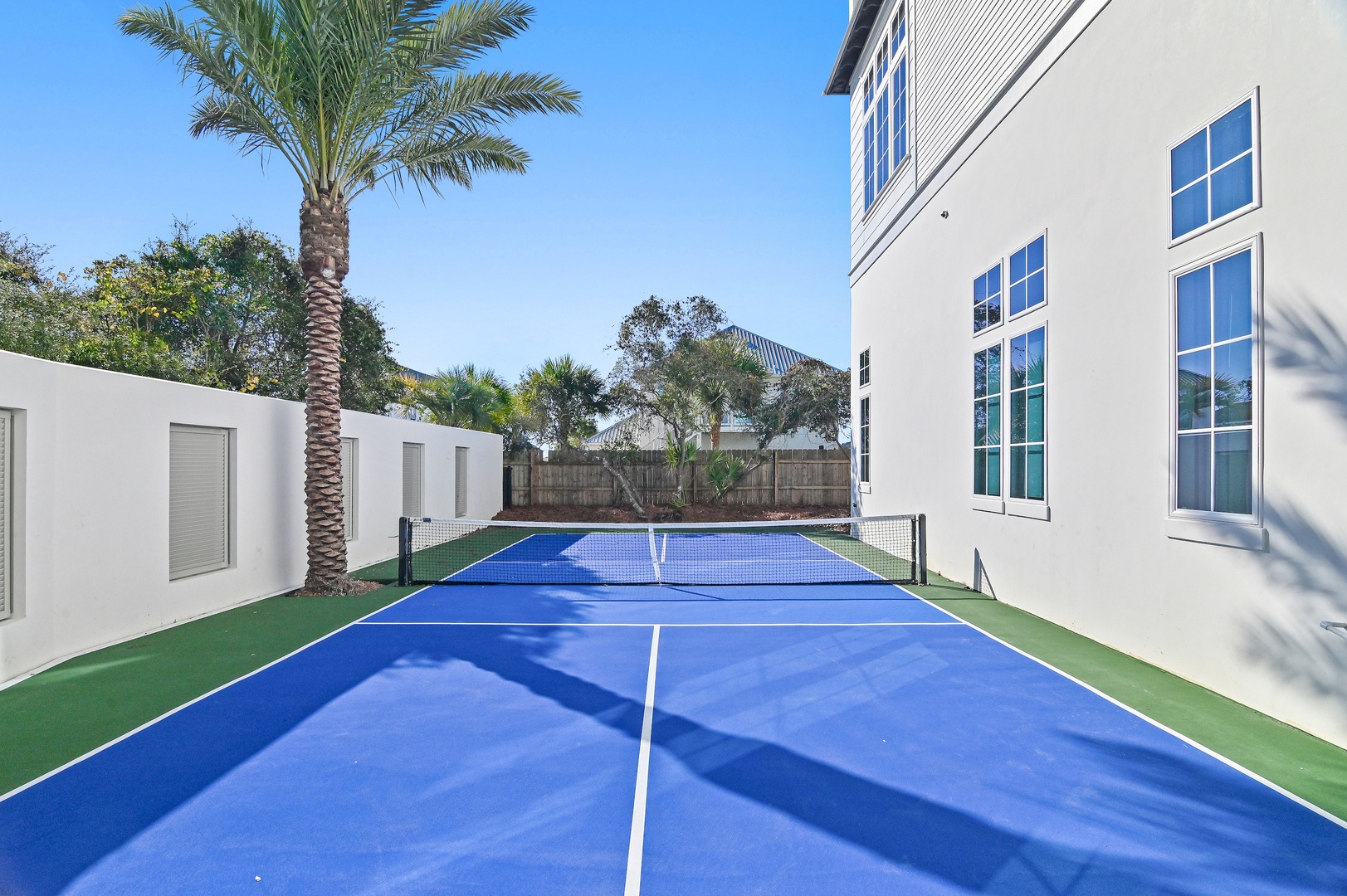 A private tennis court awaits your friendly matches, framed by tropical palms and sunshine. Challenge your travel companions to a game in this pristine, sun-drenched setting—perfect for active mornings or lazy afternoon rallies.