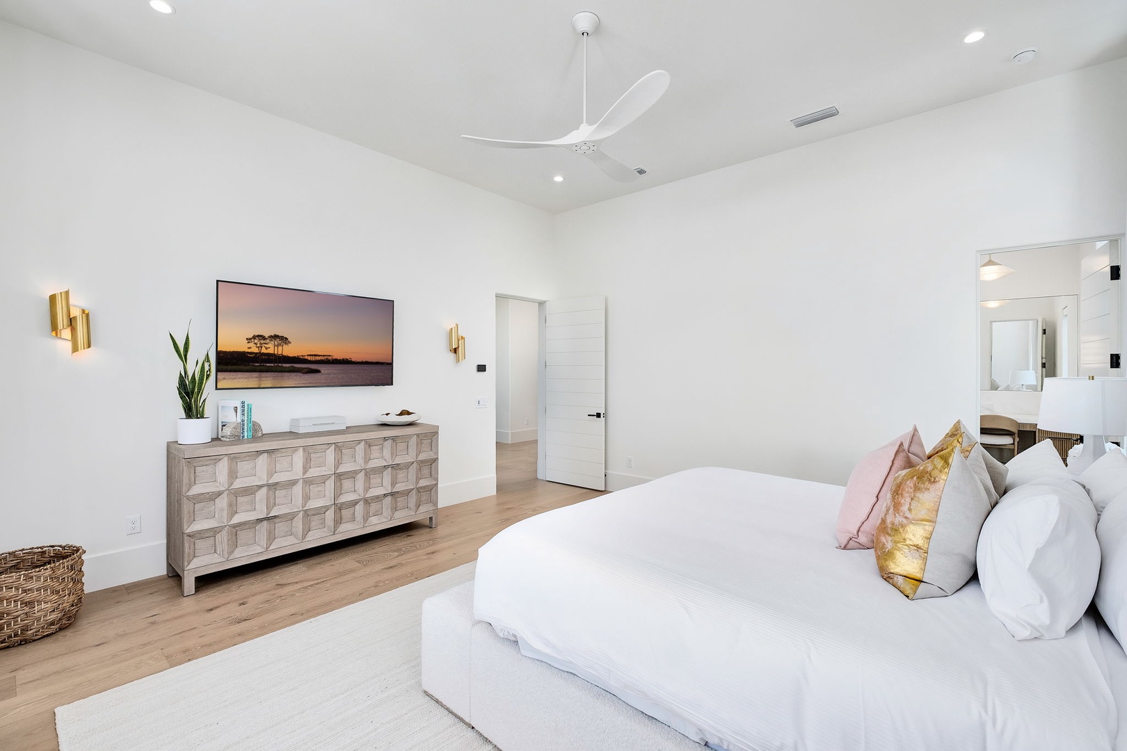 Your serene bedroom features a cloud-soft bed with plush pillows, elegant ceiling fan, and thoughtful touches throughout. The en-suite bathroom awaits just steps away for ultimate convenience.