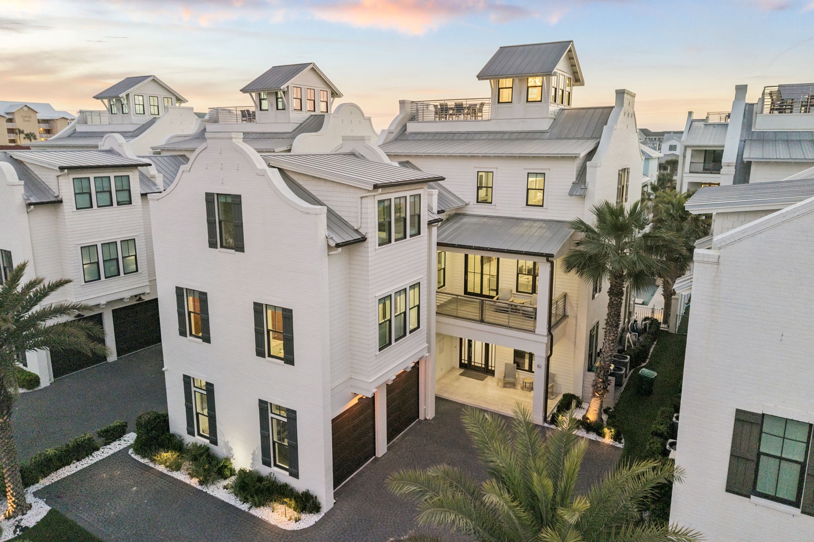 Elegant coastal community featuring modern architectural design with pristine white exteriors and contemporary styling throughout the neighborhood.