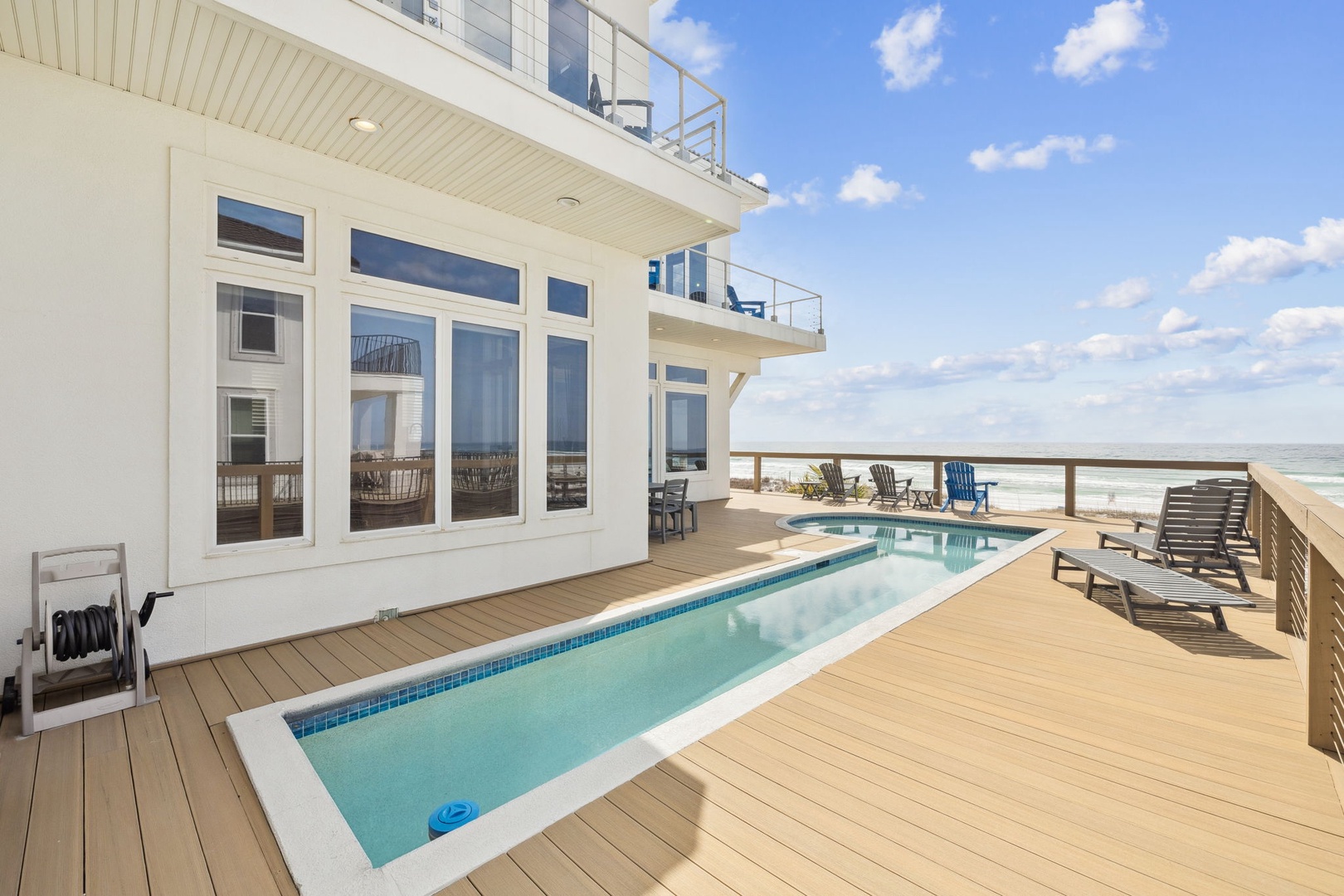 Take a refreshing dip in your private pool while enjoying stunning ocean views from this expansive deck.