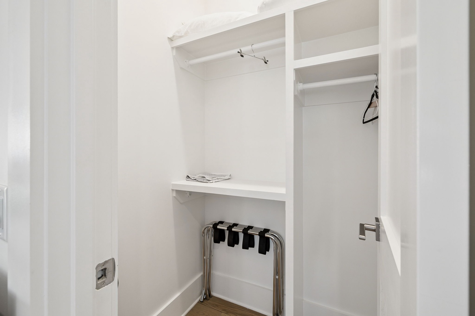 Your spacious walk-in closet offers ample storage with built-in shelving and hanging space for all your belongings.