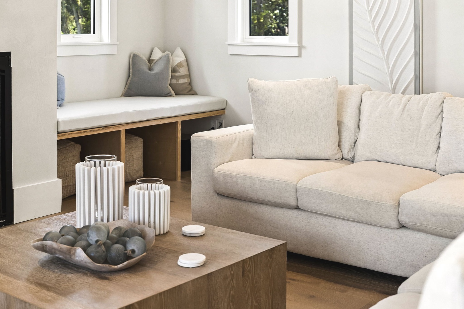 Sink into plush seating and natural light in your serene living space, designed for ultimate relaxation and comfort.