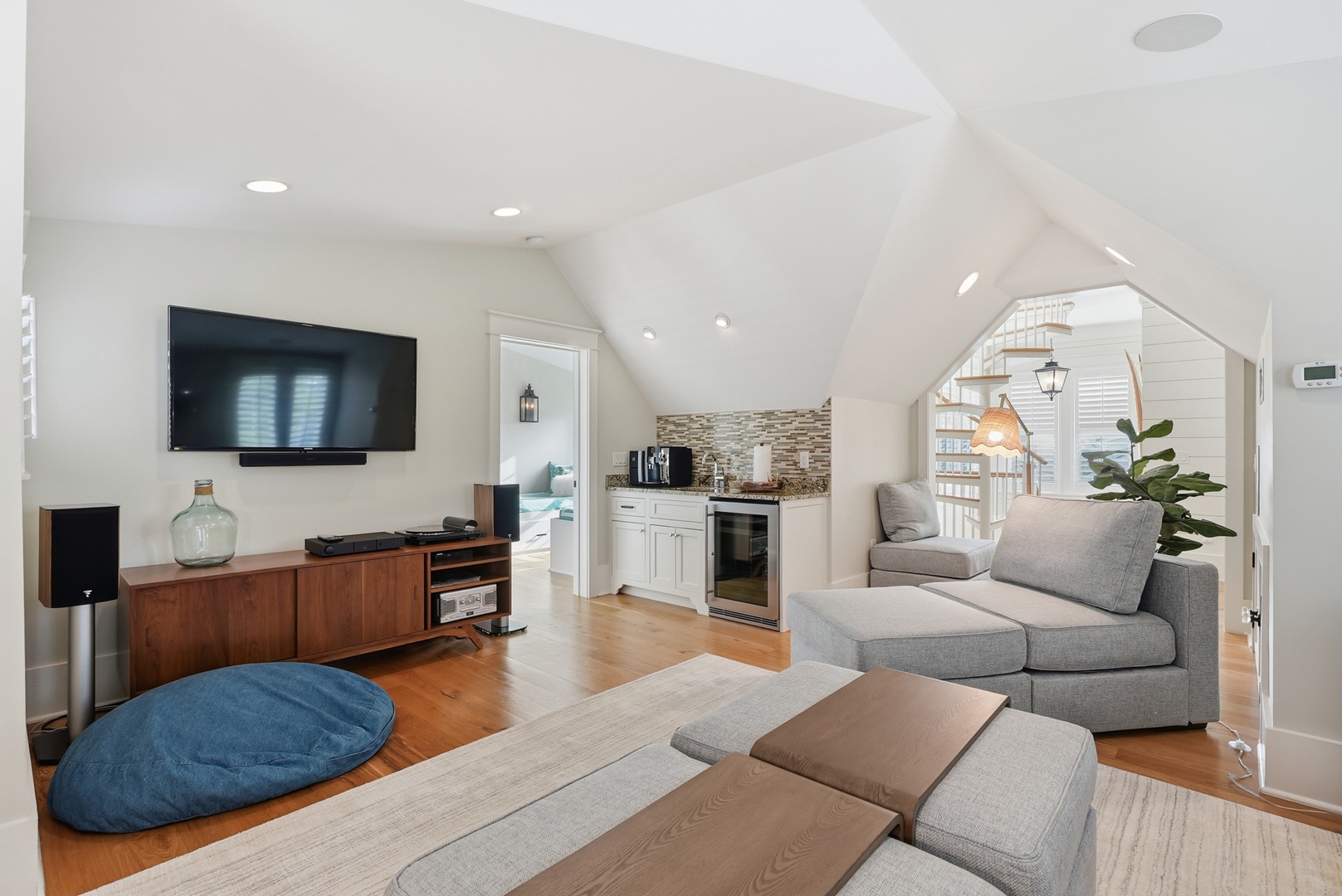 Unwind in your bright living area with vaulted ceilings, cozy seating, and a well-equipped kitchenette—perfect for streaming your favorite shows or preparing light meals.