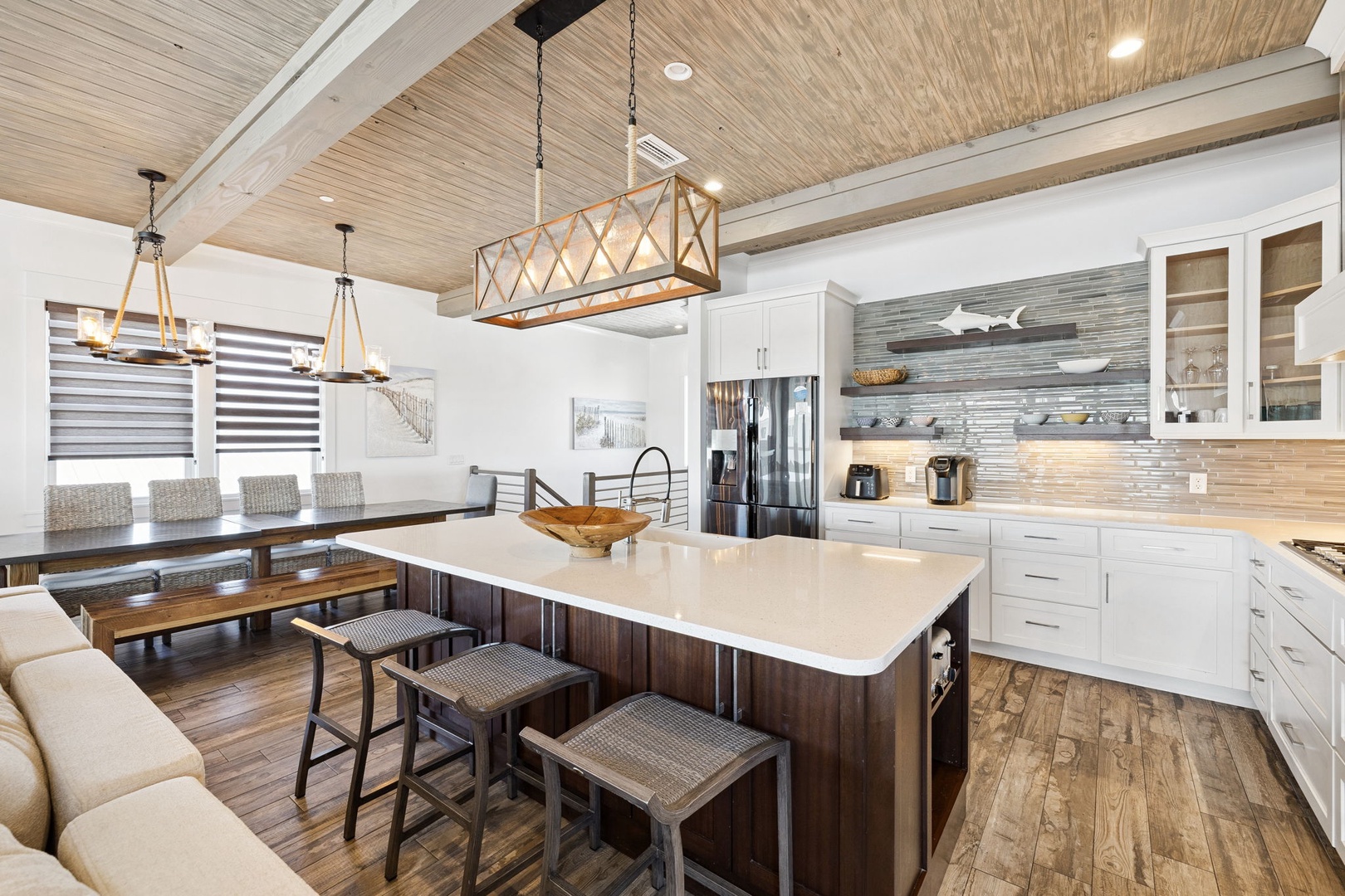 Step into your stunning open-concept kitchen with white quartz island, designer lighting, and everything you need to create memorable meals together.