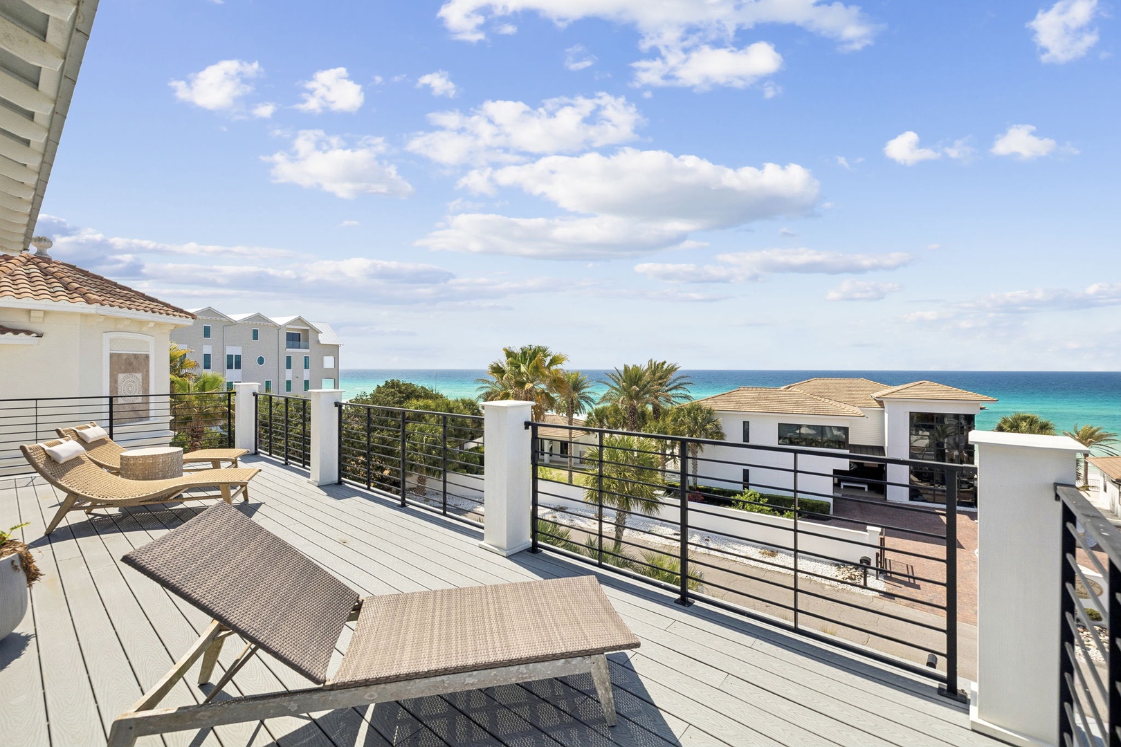 Step onto your private terrace and soak in the stunning turquoise ocean views while lounging on comfortable chairs.