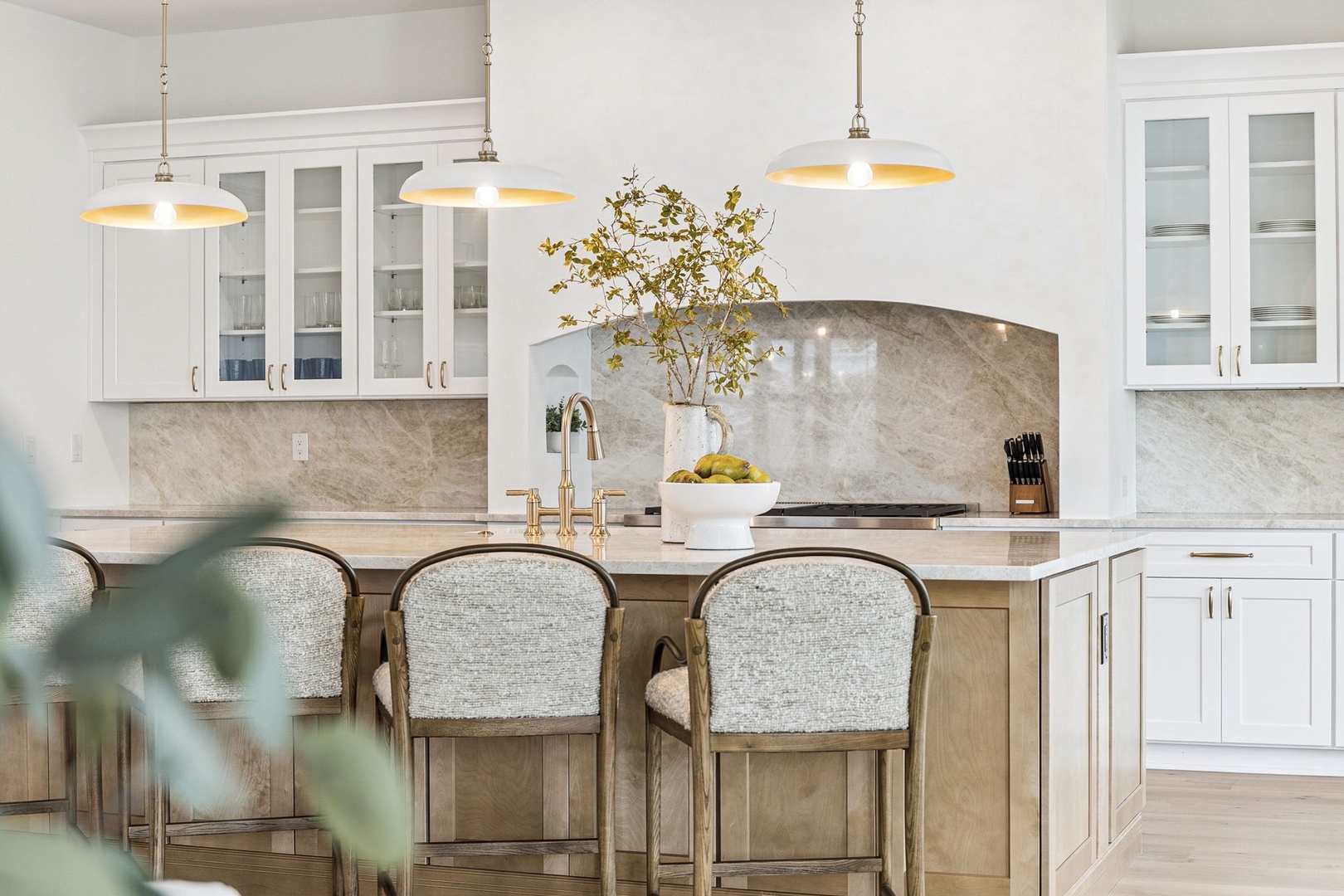 Step into your gourmet kitchen where marble countertops and warm pendant lighting create the perfect backdrop for memorable meals together.