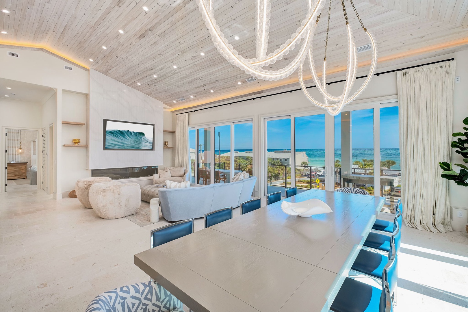 Stunning coastal living awaits you in this open-concept space where soaring ceilings and expansive ocean-view windows flood the room with natural light, creating your perfect beachside gathering spot.