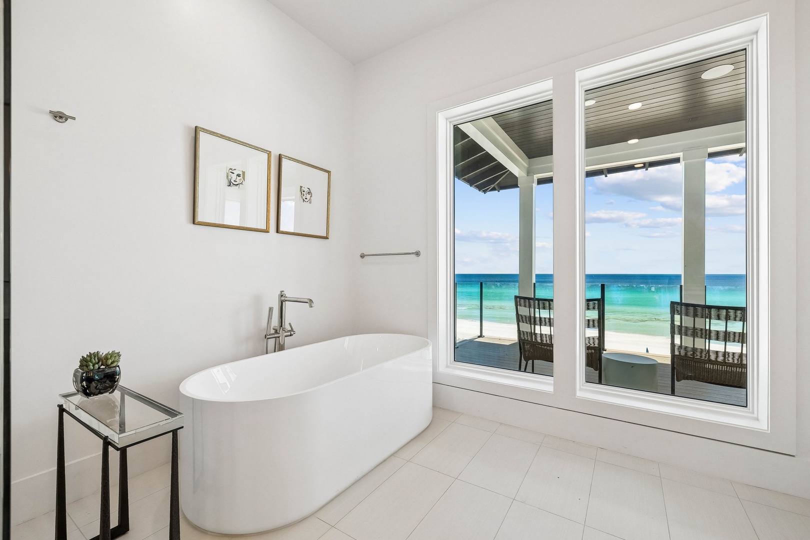 Soak in serenity with your oceanfront escape—your spa-like tub overlooks turquoise waters and soft sandy shores, inviting you to unwind in pure luxury.