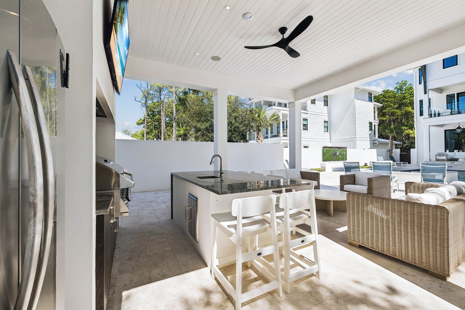 Step into your private outdoor oasis, where a stylish bar invites you to gather with friends while surrounded by resort-like amenities and natural beauty.