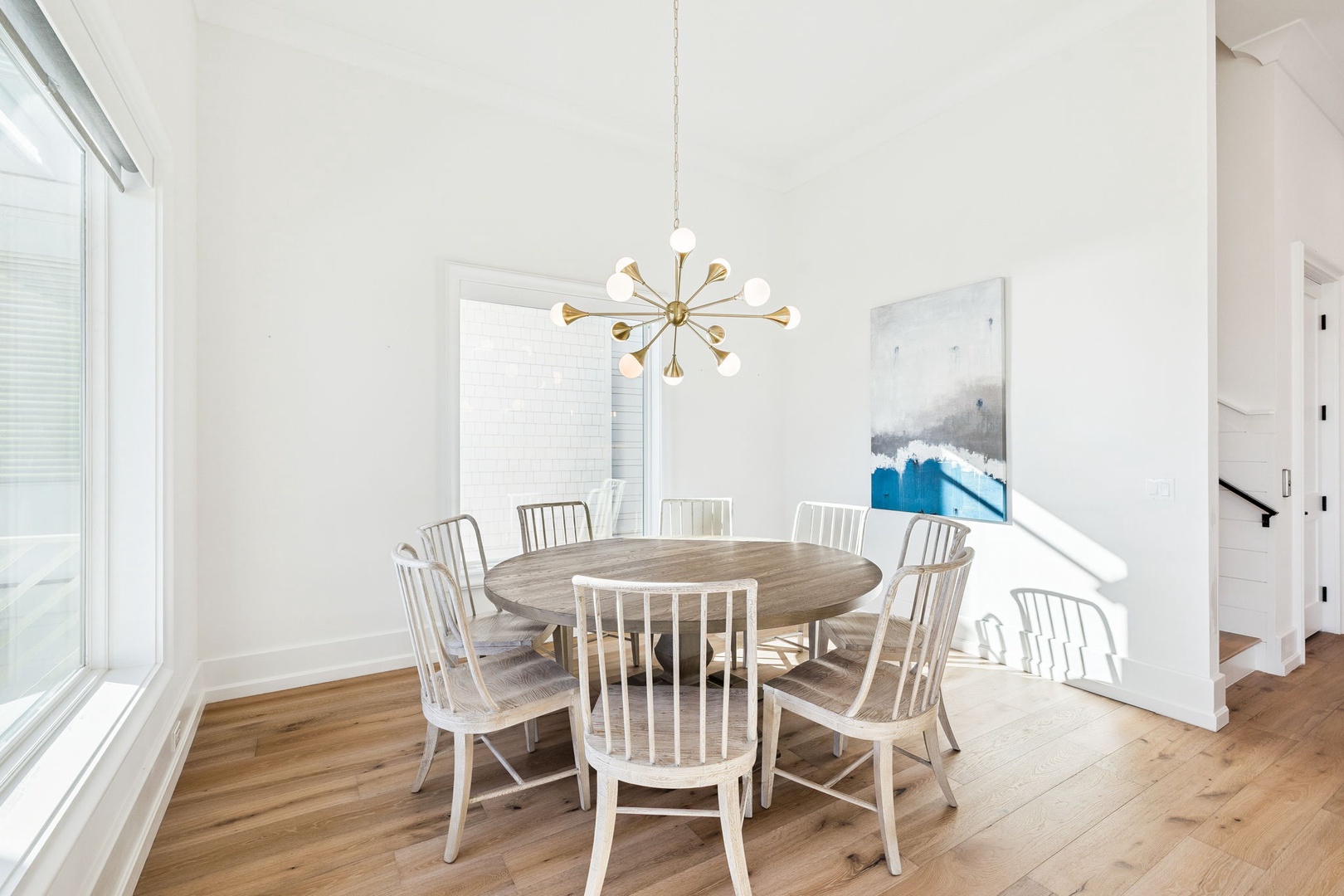 Gather around your stylish dining table where coastal charm meets modern elegance, perfect for memorable meals together.