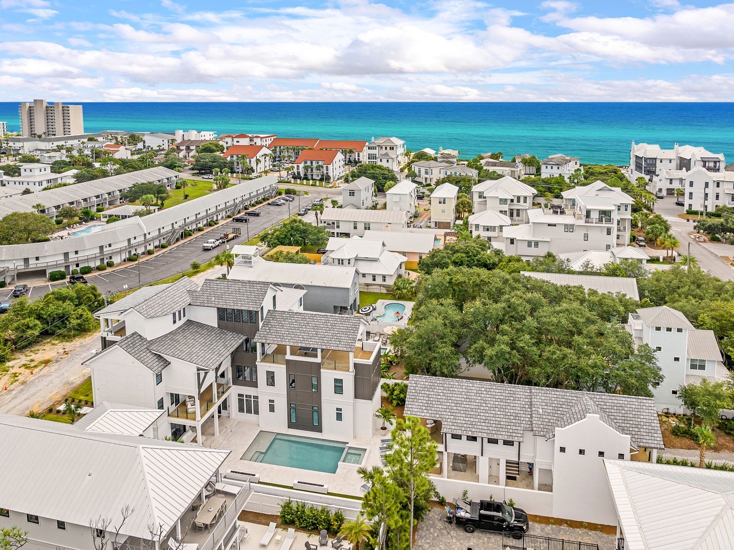 This beachside community offers easy access to stunning turquoise Gulf waters, with the property nestled among coastal homes just steps from the shore.