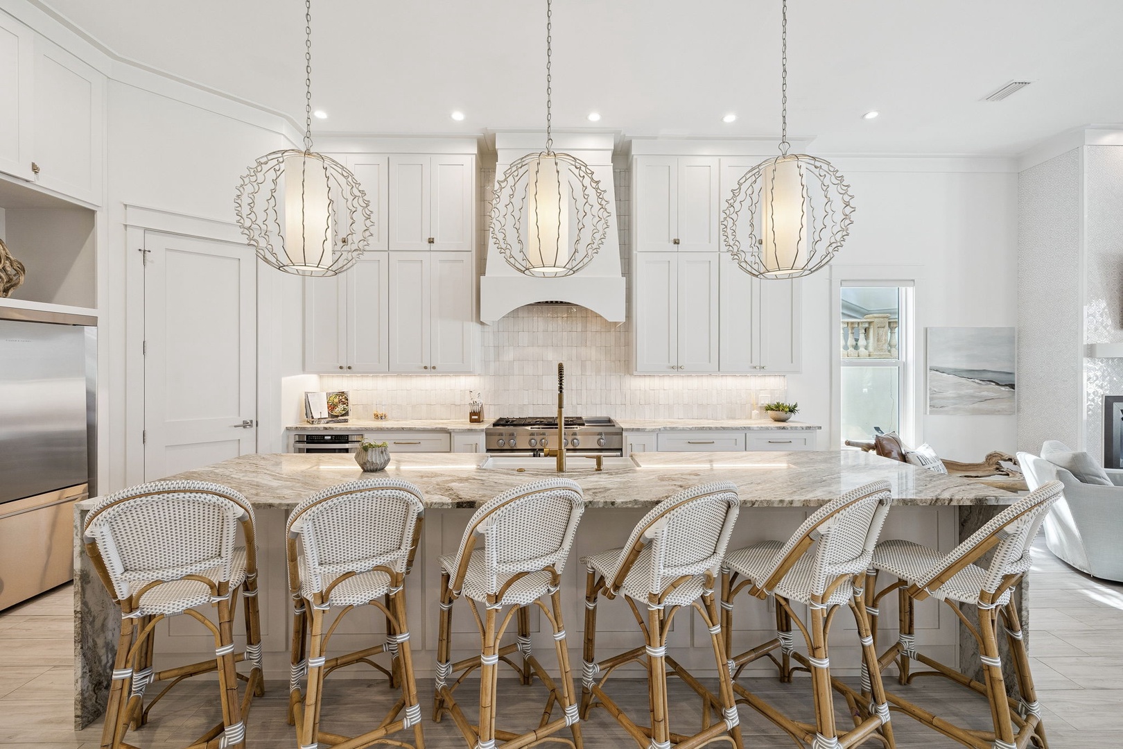 Your dream kitchen awaits with marble island seating, elegant pendant lighting, and premium appliances perfect for memorable meals.