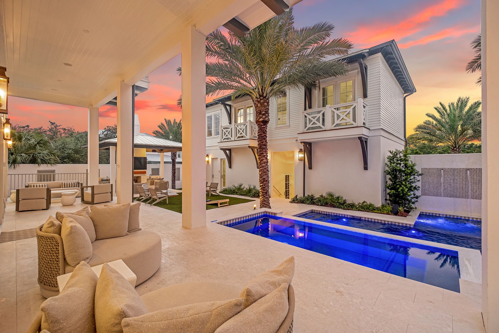 Your private outdoor retreat features a stunning pool and covered lounge—perfect for lazy afternoons or sunset cocktails beneath tropical palms.