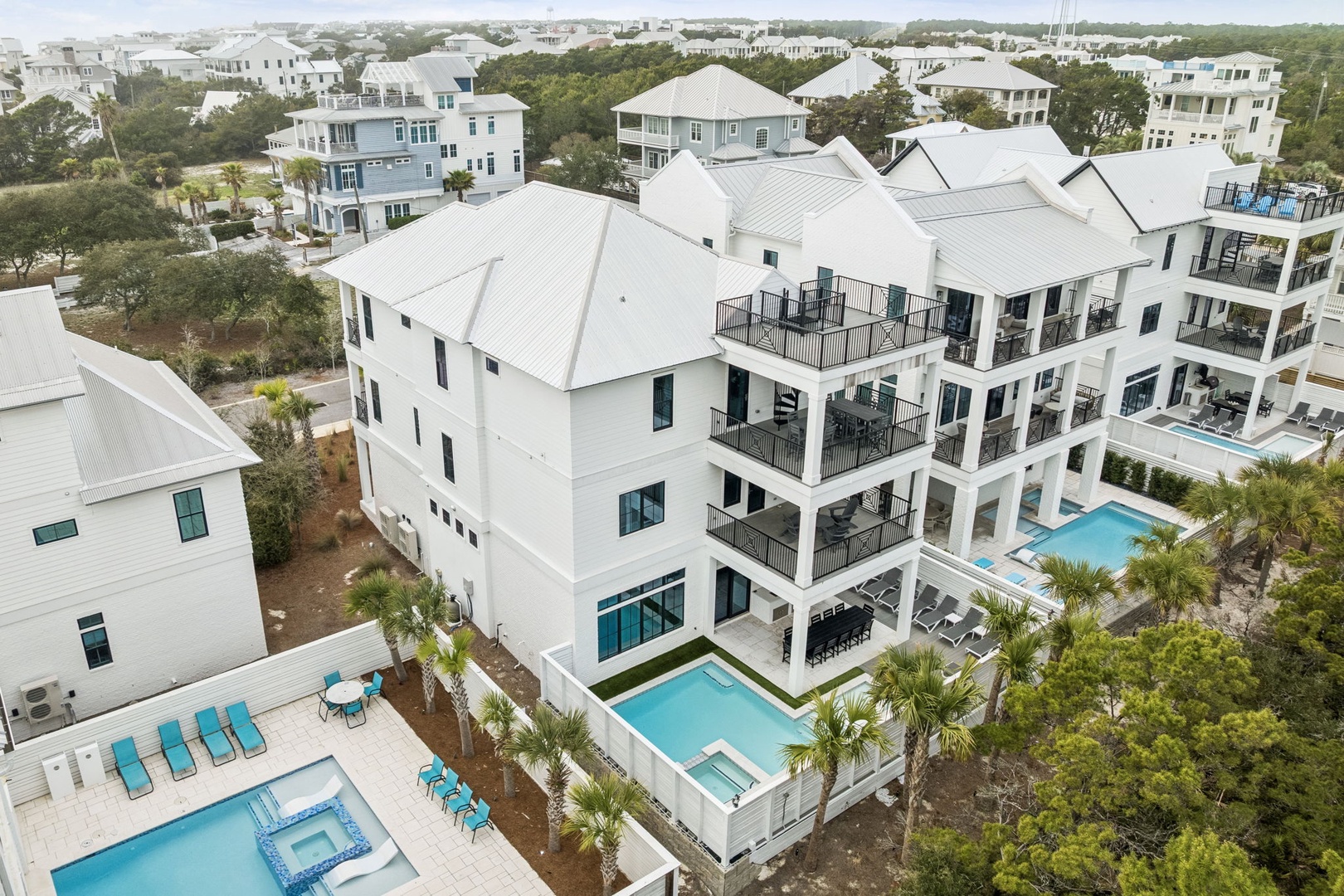 Luxurious beachside vacation homes with private pools nestled in a prestigious coastal community.