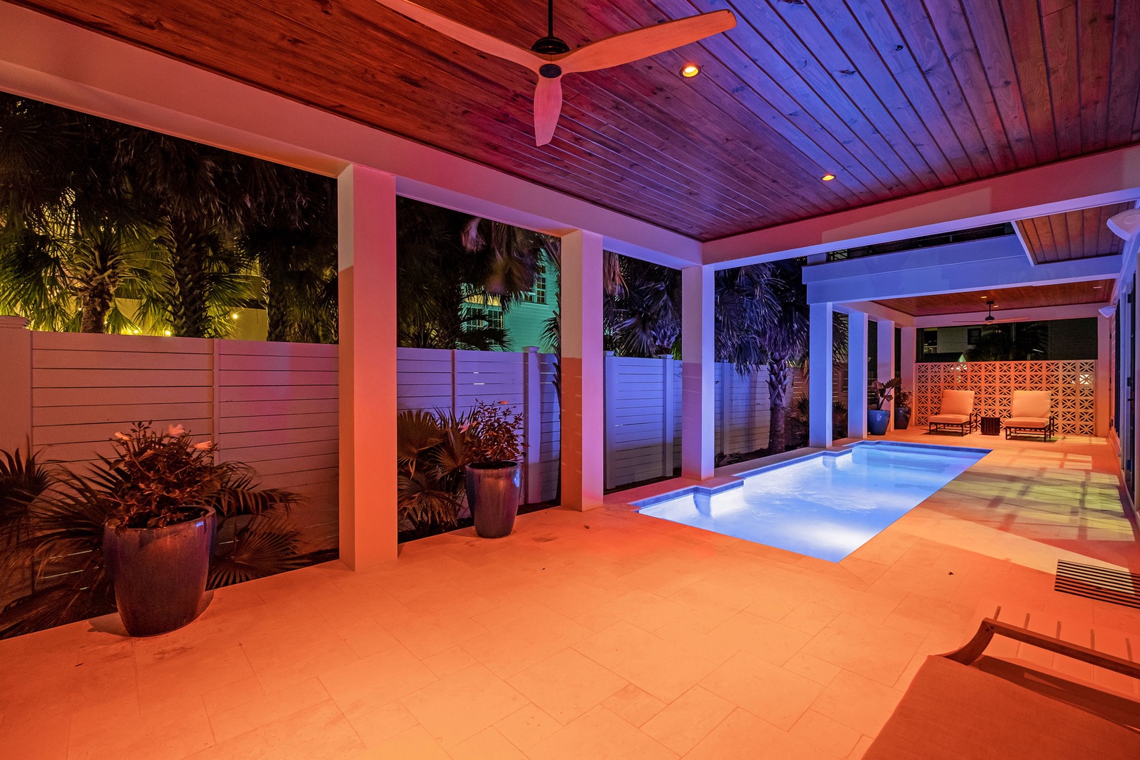 Unwind in your private paradise with glowing pool waters and tropical ambiance at dusk.