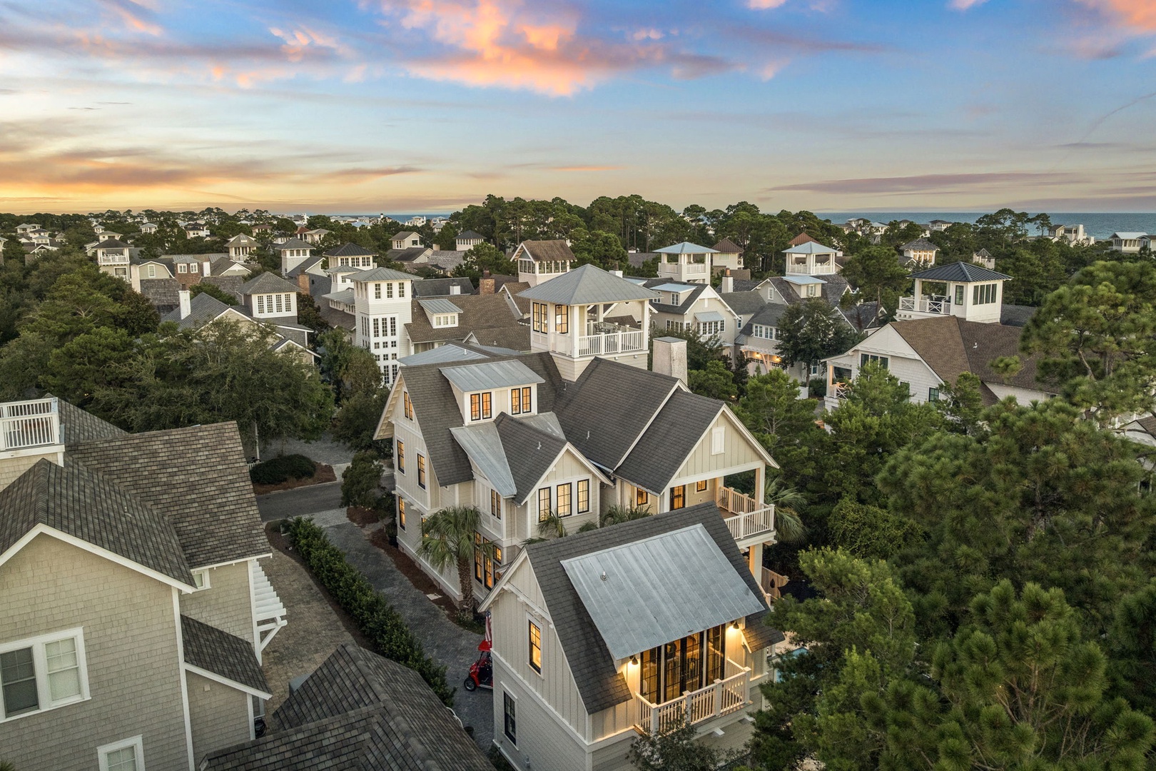 Nestled in a coastal neighborhood surrounded by lush pines, this property is moments from the sea and part of a charming, close-knit community.