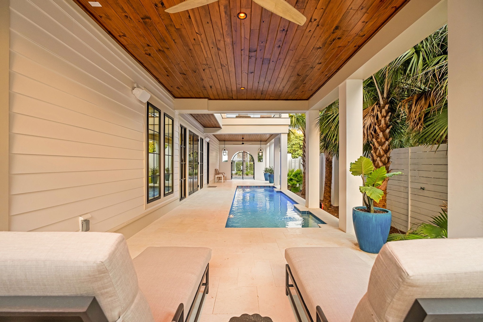 Unwind poolside in your private covered retreat with stunning wood ceilings and tropical garden views.