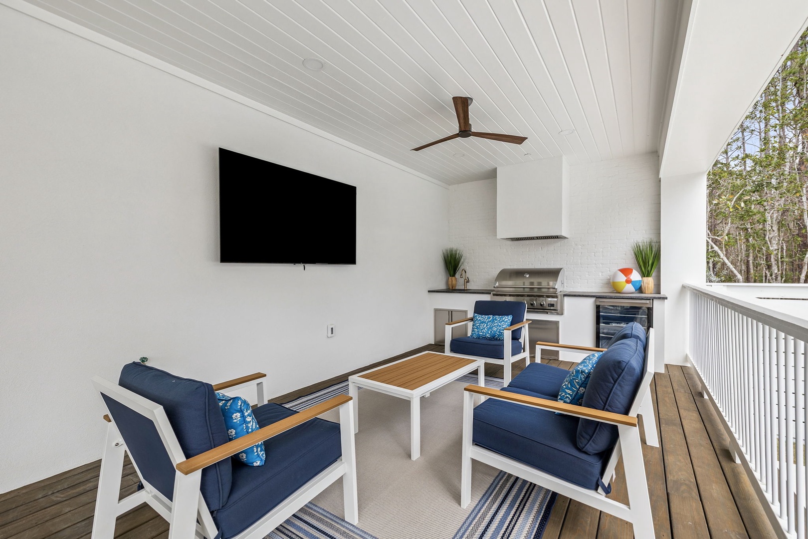 Unwind on your private covered terrace with cozy seating, outdoor kitchen, and TV for perfect alfresco entertaining.